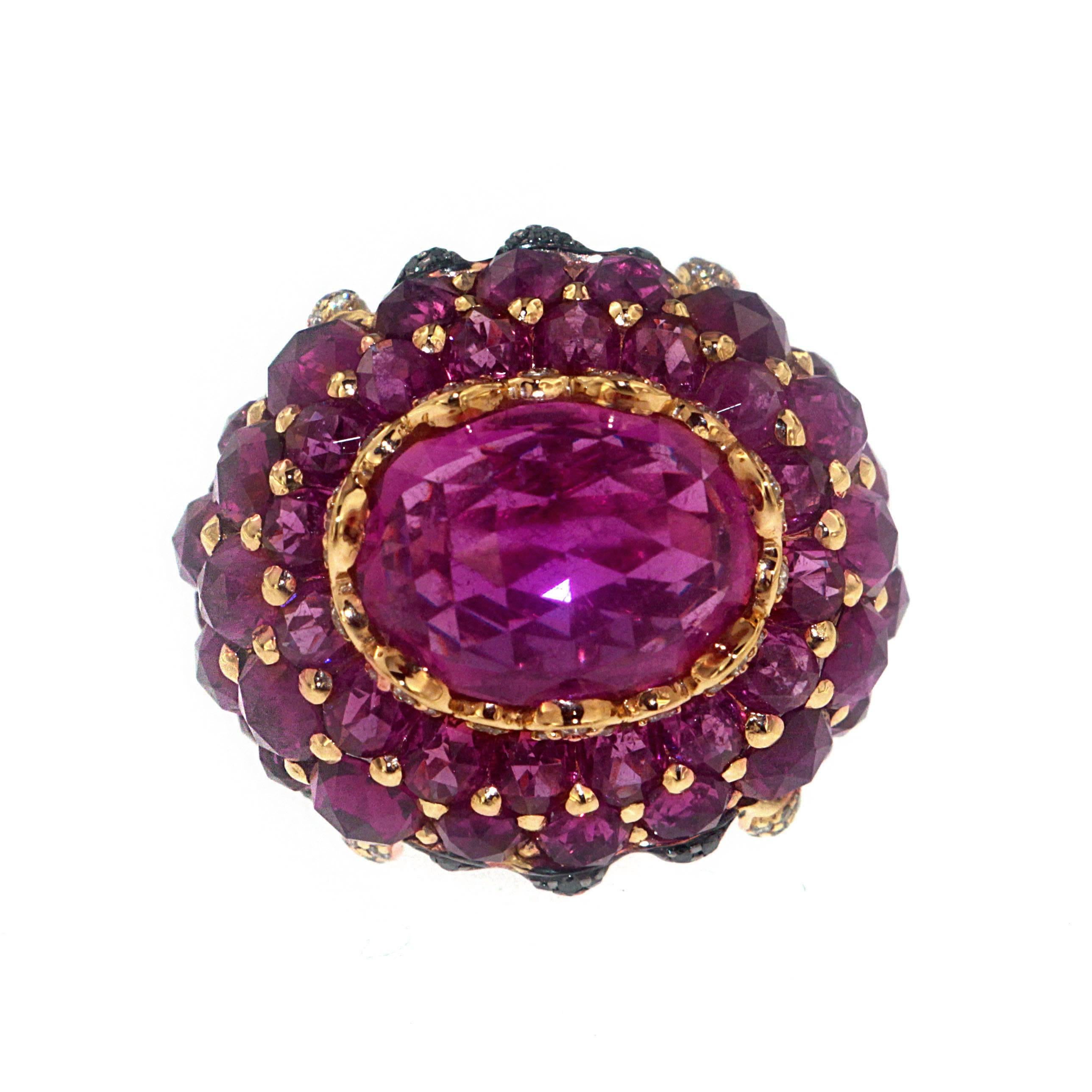 Indulge your sweet tooth with this stunning Multi-faceted cut Rubellite cocktail ring draped in Rubellite totaling 30.53 Carats. This original Zorab masterpiece is embellished with 0.54 Carats of treated Black Diamonds and 0.61 Carats of White