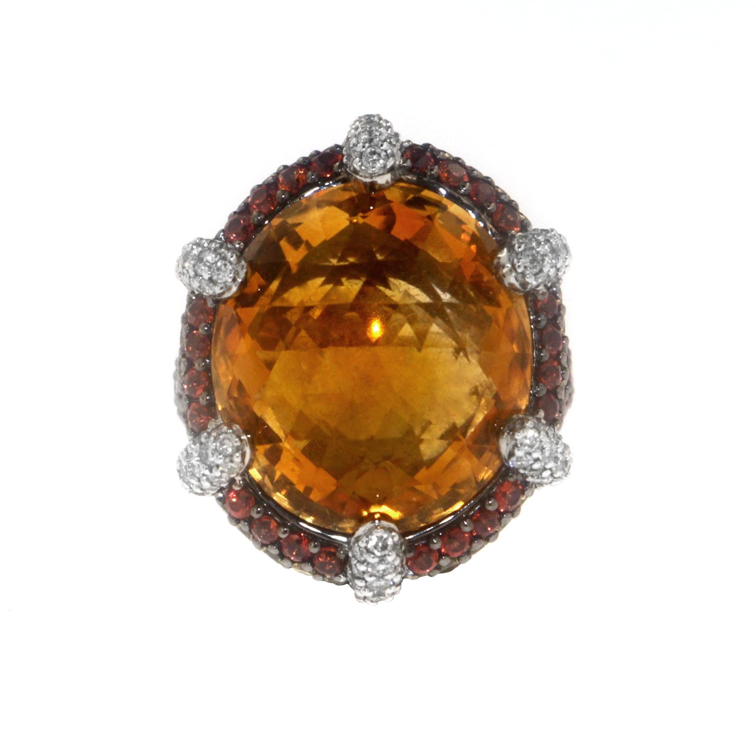 Make a statement with Zorab's multi-faceted 21.19 Carat Citrine Quartz glamorous cocktail ring set on gold and palladium. 1.19 Carats of White Diamonds clamp the center stone, while 2.81 Carats of Orange Sapphires envelop and amplify its intensity.