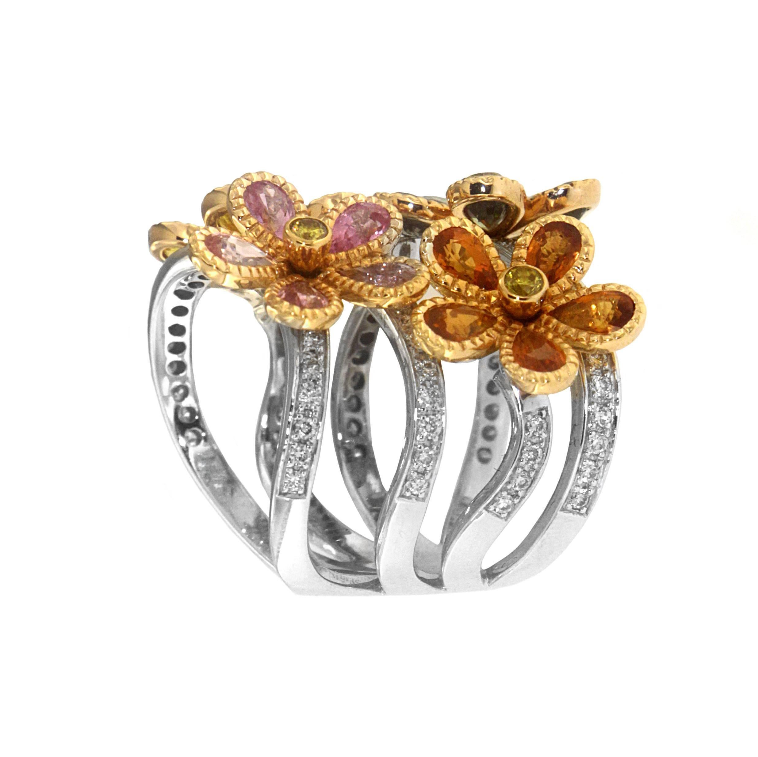 Zorab captures nature with its most delicate delight - blooming flowers created with 2.31 Carats of Green Sapphire, 2.00 Carats of Orange Sapphire, and 2.01 Carats of Pink Sapphire. The twinkling bouquet is set with 0.77 Carats of White Diamonds and
