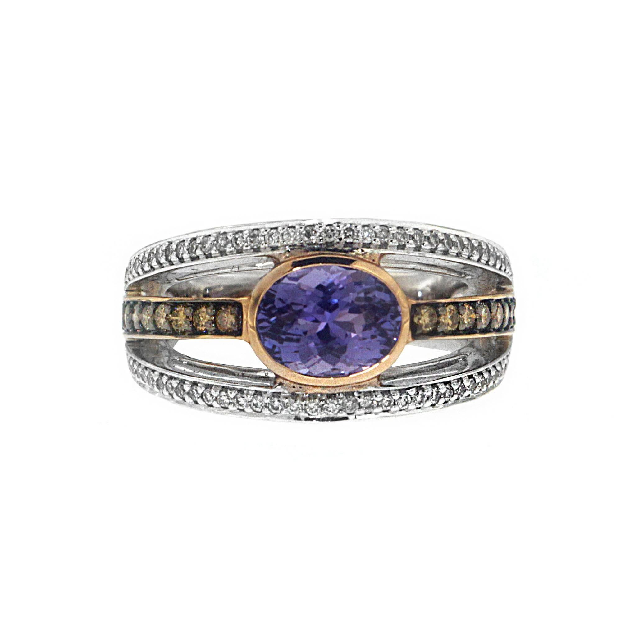 Set with a central stone from 2.65 carats of unmistakably mysterious tanzanite, the cyclical element of this ring is split into three to create an utterly unique effect.

The integral ring is fashioned from a quality yellow gold, and the two outer