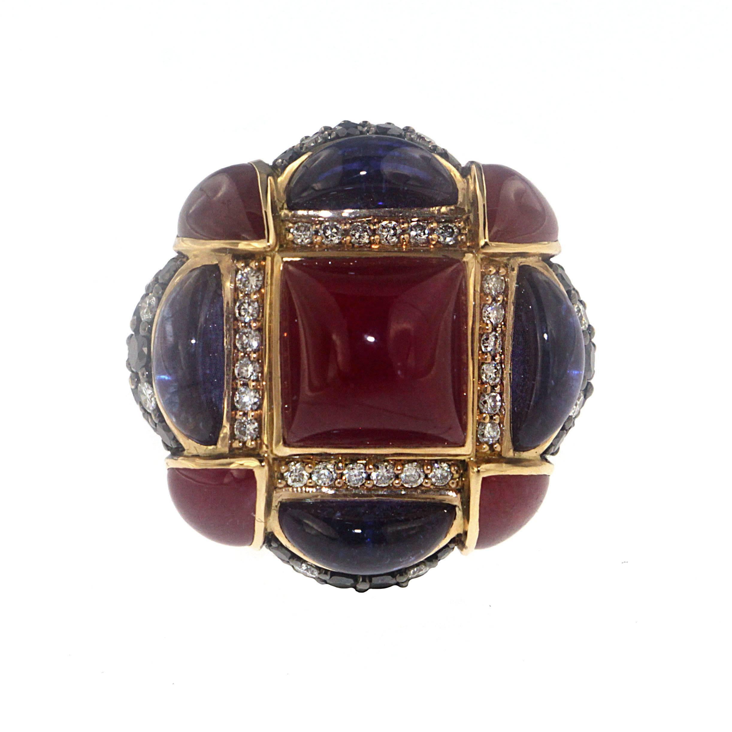 Rule your own personal kingdom with the Lady Czar ring, a Zorab Creation. 

With 18.22 carats of rubies, 6.39 carats of blue sapphires, 2.03 carats of black diamonds, and 0.84 carats of white diamonds, this is a power ring with a serious nod to