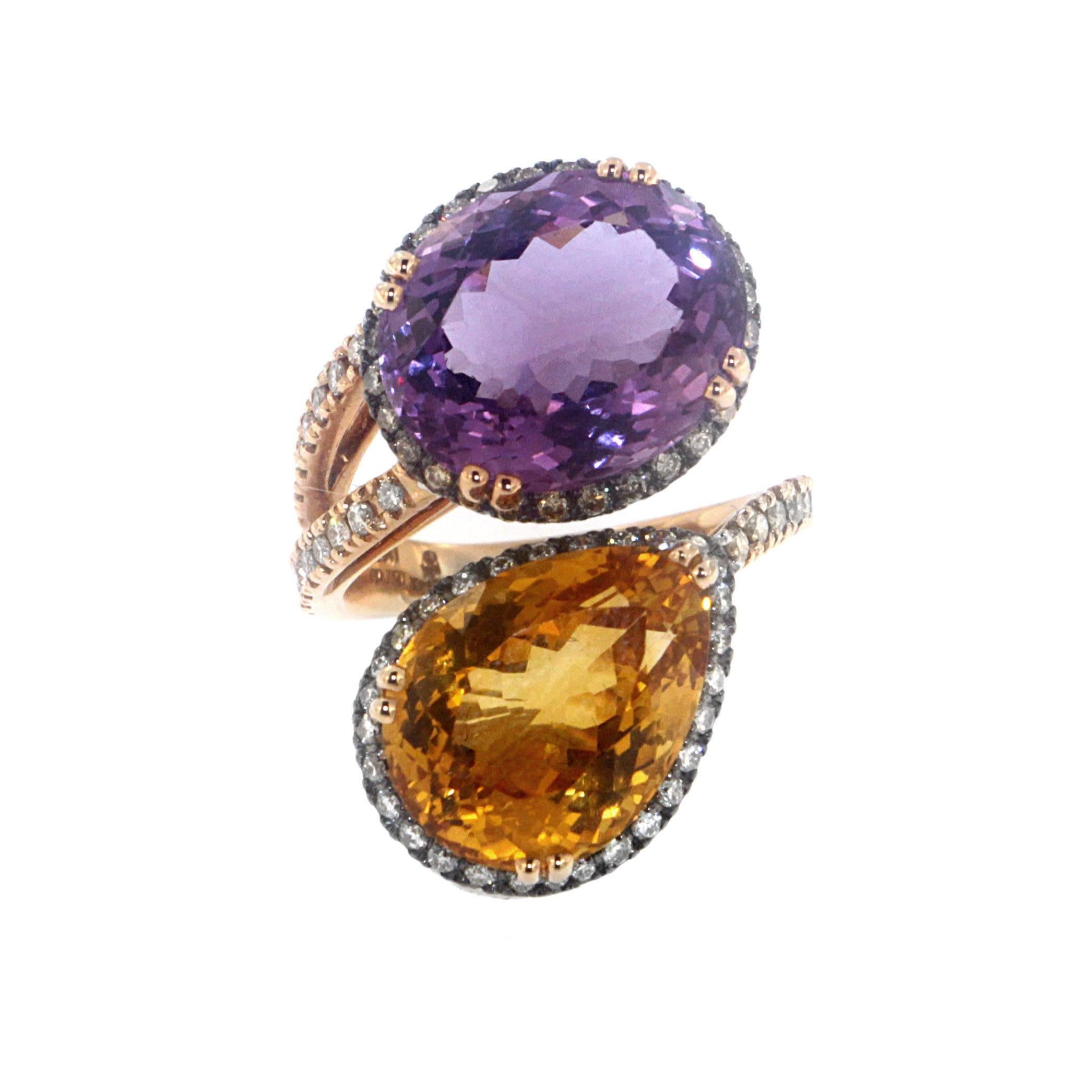 Nestled together, a teardrop shaped citrine quartz and spherical amethyst gem make the most elaborate and endearing couple.
The double twist gold and 0.45 carats white & 0.49 carat yellow diamond ring swoops up into two separate settings, one