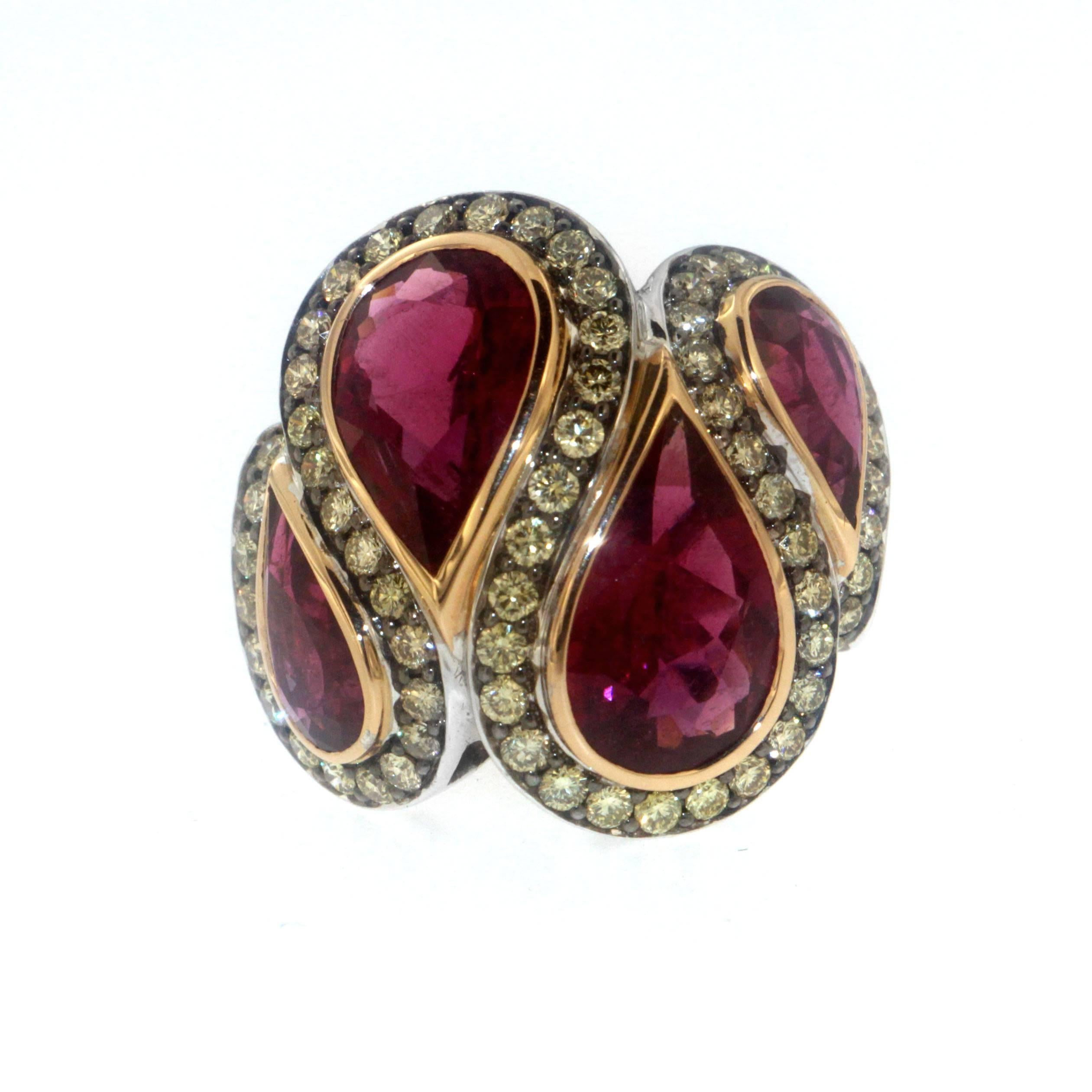 The enchanting four Ruby (9.49 Carats) teardrops flowing in a swirling motion around 1.86 Carats of Yellow Diamonds is a visual masterstroke of creativity and workmanship, accomplished by only Zorab.

This item has a serial number and bears the