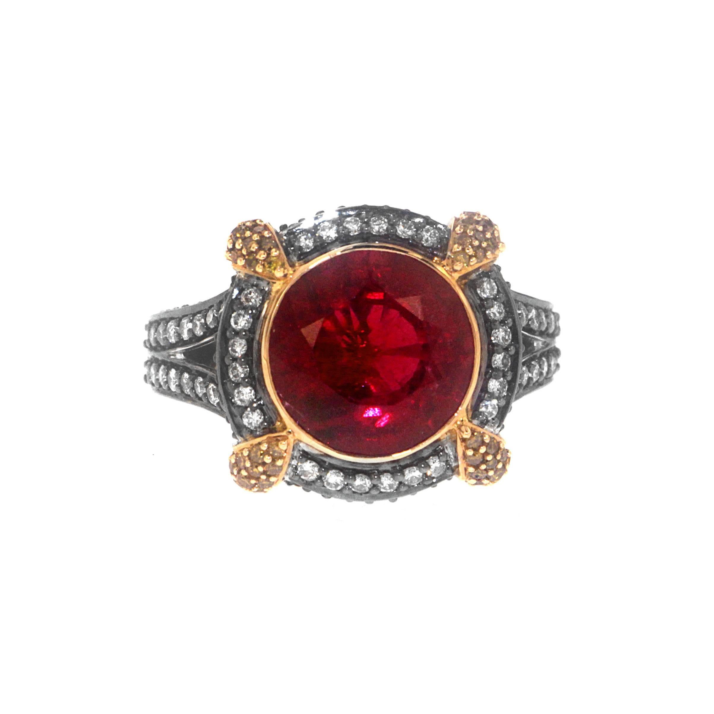 Slip into Zorab's 5.80 Carat Rubelite Gold Cocktail Ring befitting a queen.  0.63 Carats of White Diamonds circle the center stone and draw down the sides as 1.06 Carats of Yellow Diamonds clamp the four corners of this magnificent hand-crafted