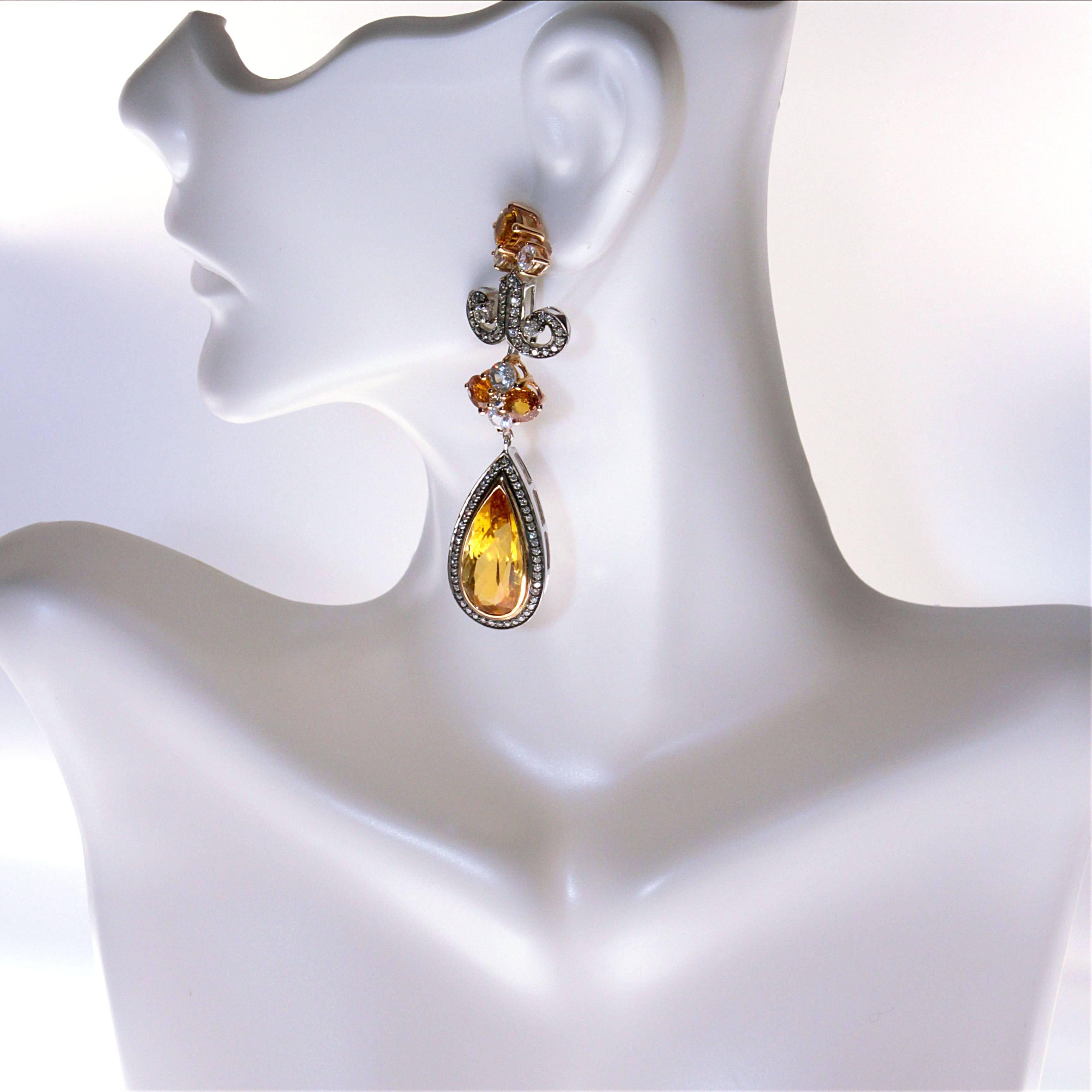 Zorab reinvents the drop earring with this stunning 18.24 Carat Citrine Quartz design set on 18 Karat Gold and Palladium. The center stones are surrounded by 2.50 Carats of White Zircon (not to be mistaken with zirconia) and 1.40 Carats of White