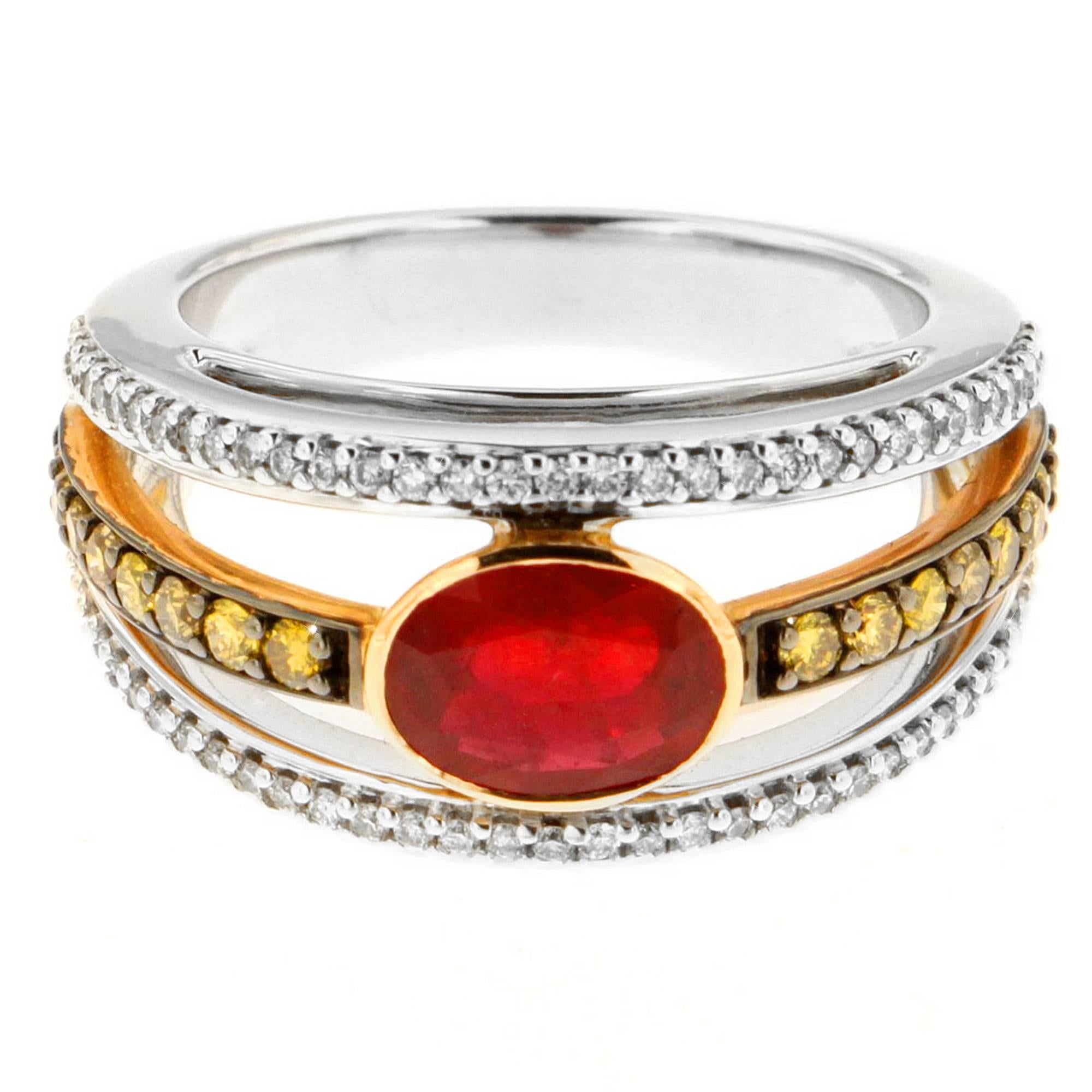 Say hello to the New Classic! Zorab's halo style ring features a 1.78 Carat Ruby Center Stone with 0.38 Carats of White Diamonds and 0.40 Carats of yellow Diamonds emphasizing the fiery glow of the Ruby. 

This item has a serial number and bears the
