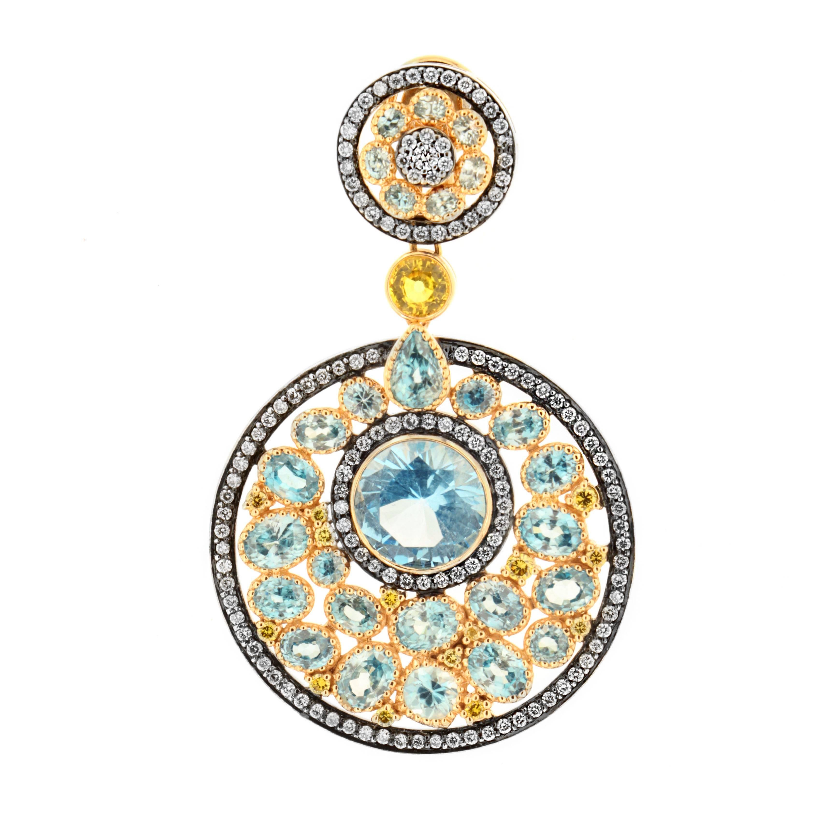 Inspired by ancient Native American origins, the Dreamcatcher earring by Zorab Creation is as complex and structured as it is alluring. 

For this meticulous design, 18k Gold and Palladium embrace brilliant sky blue topaz gemstones, 10.75 Carats.