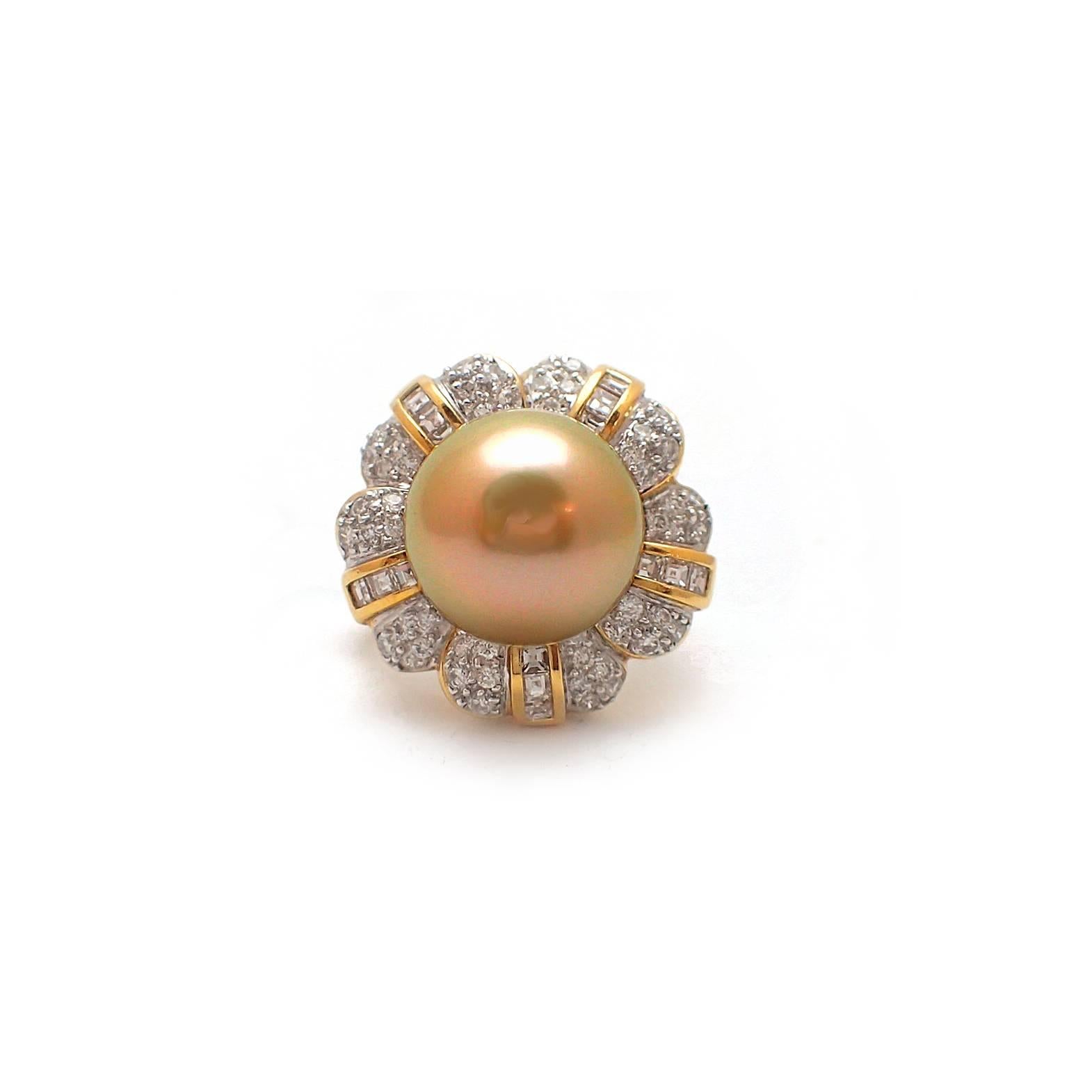 Luxurious golden South Sea pearl and diamond ring.  Features a 13mm round SS pearl and surrounded by 1.25ct of square and round diamonds.  Set in 18k two tone mounting. G color, VS2-SI1 clarity.