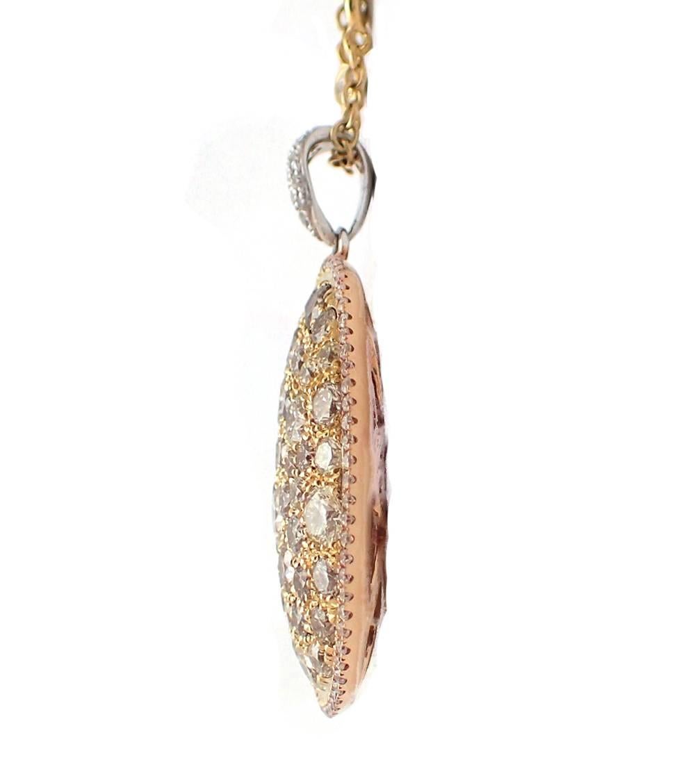 Multi-colored diamond necklace in 18k yellow, rose and white gold.  Pendant and chain feature an assortment of brown, yellow and white diamonds totaling over 3.50ct.  Priced with 16