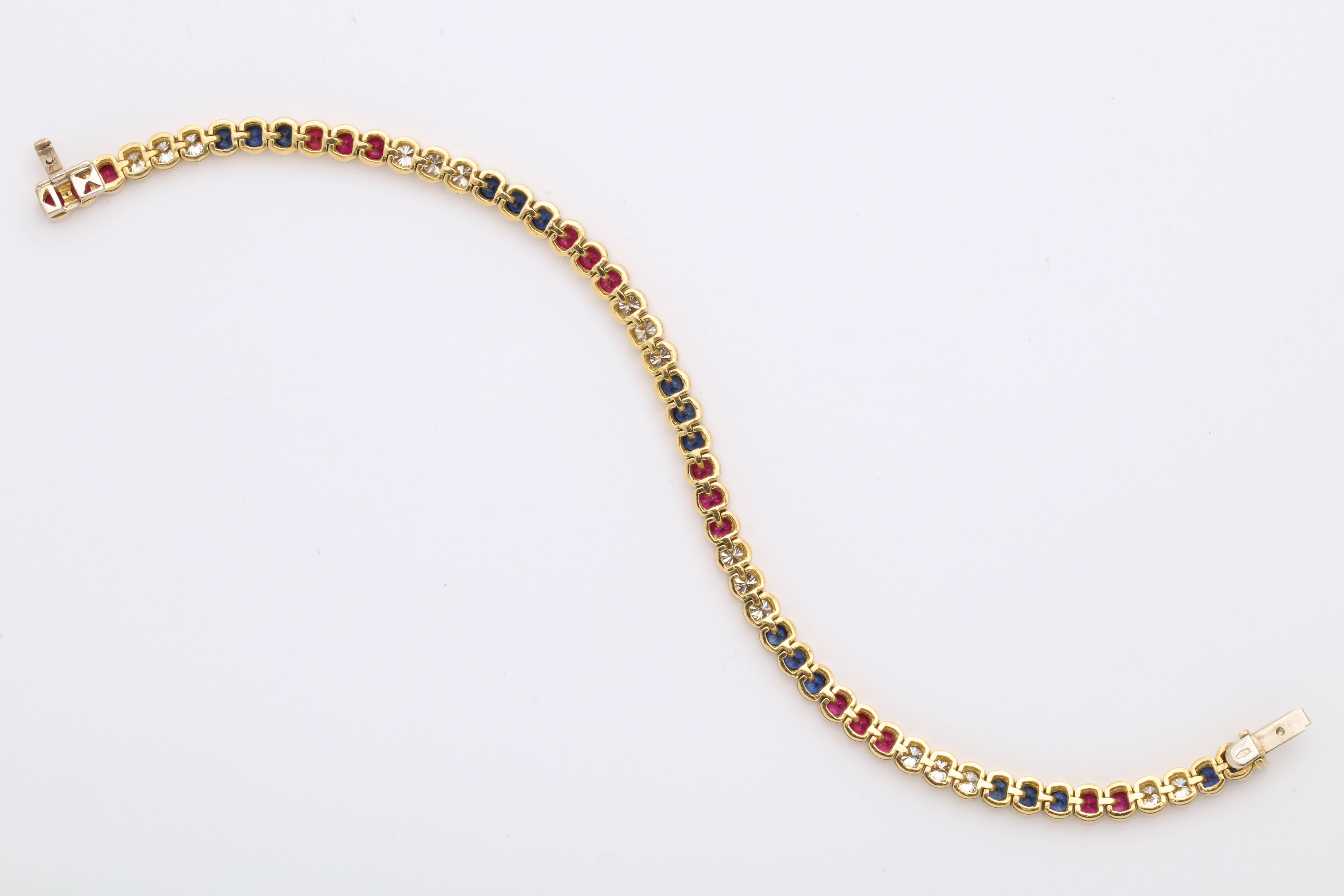 Contemporary Diamond, Ruby and Sapphire Yellow Gold Tennis Bracelet For Sale