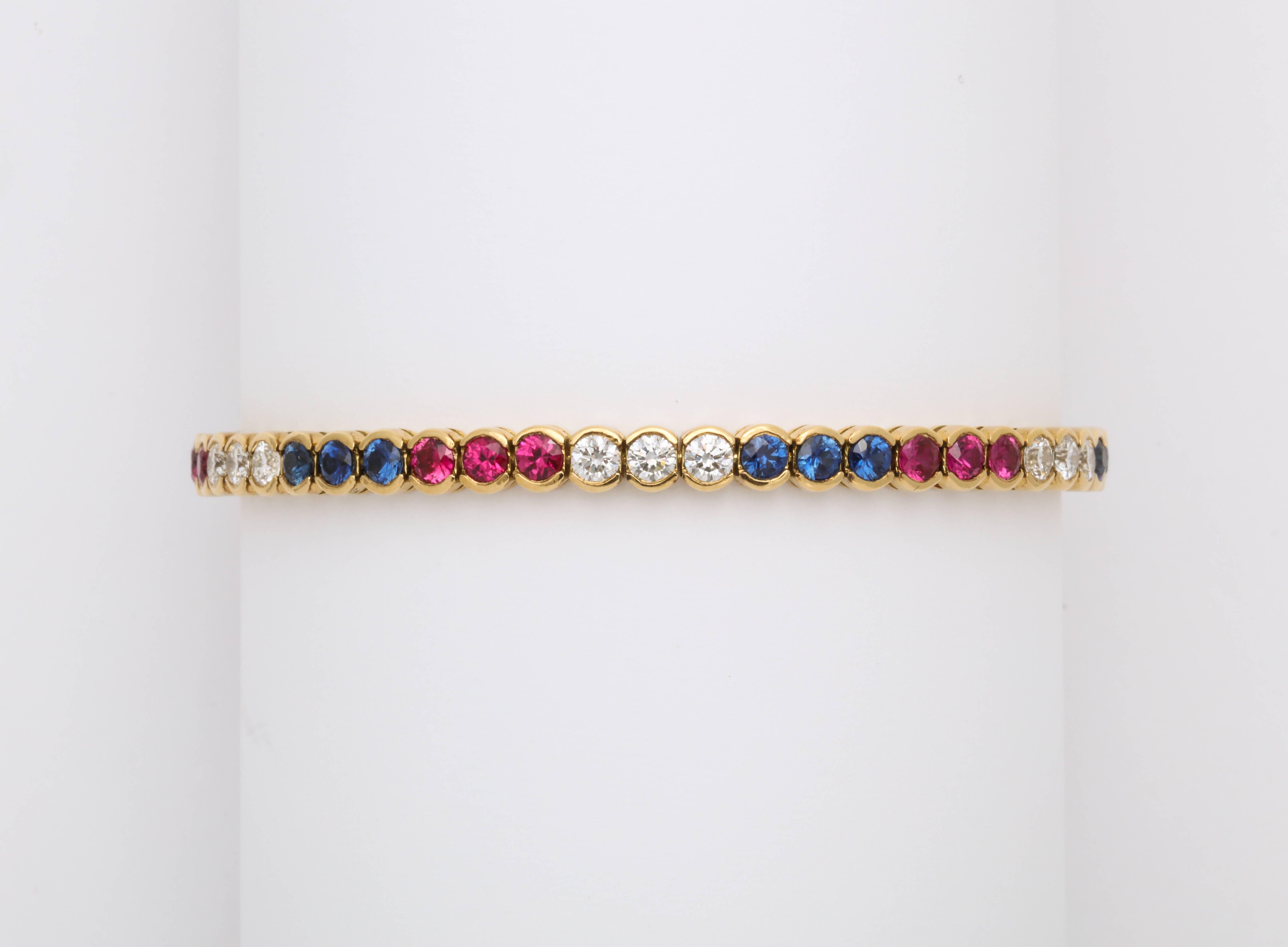 Round Cut Diamond, Ruby and Sapphire Yellow Gold Tennis Bracelet For Sale