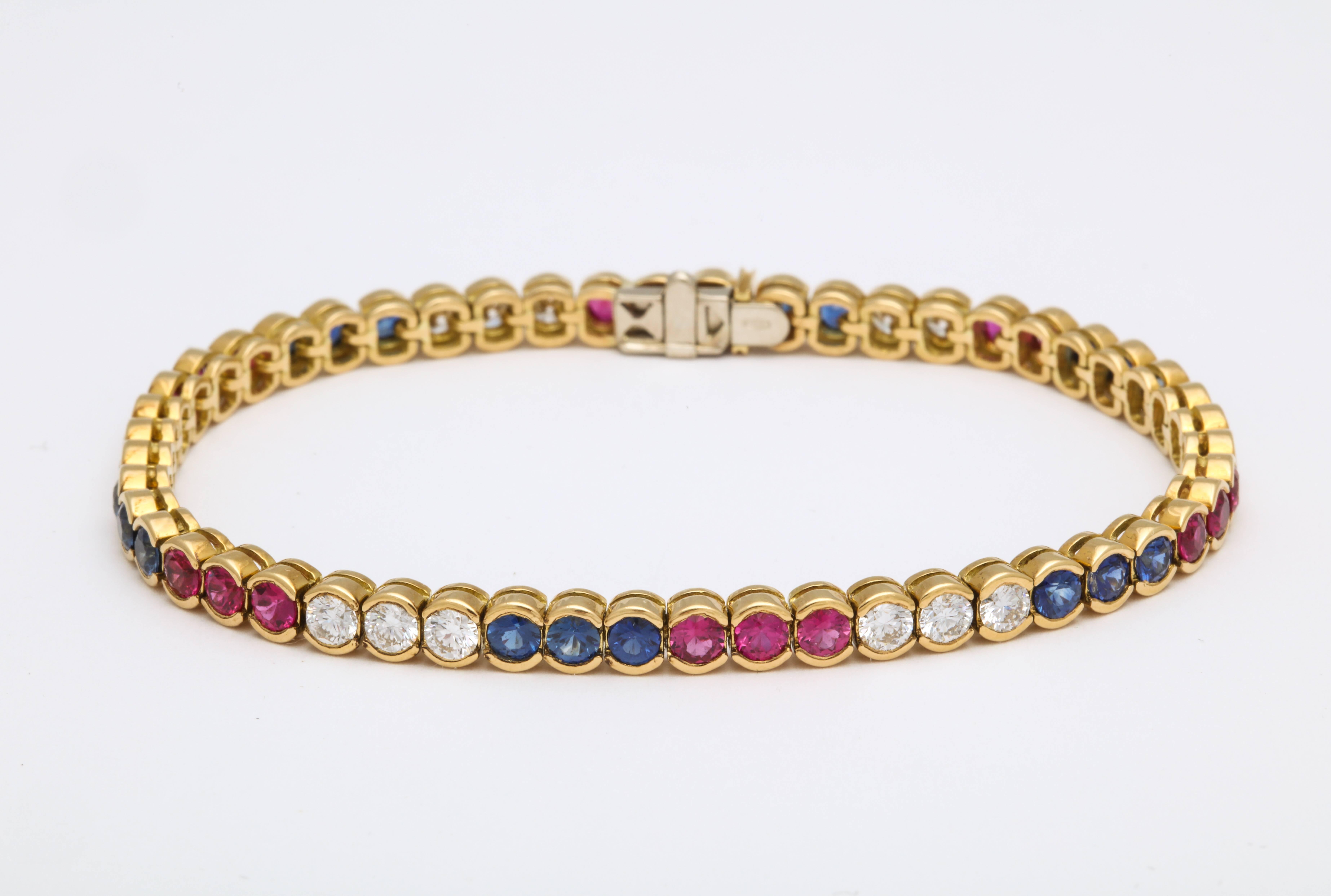 Diamond, Ruby and Sapphire Yellow Gold Tennis Bracelet In New Condition For Sale In New York, NY