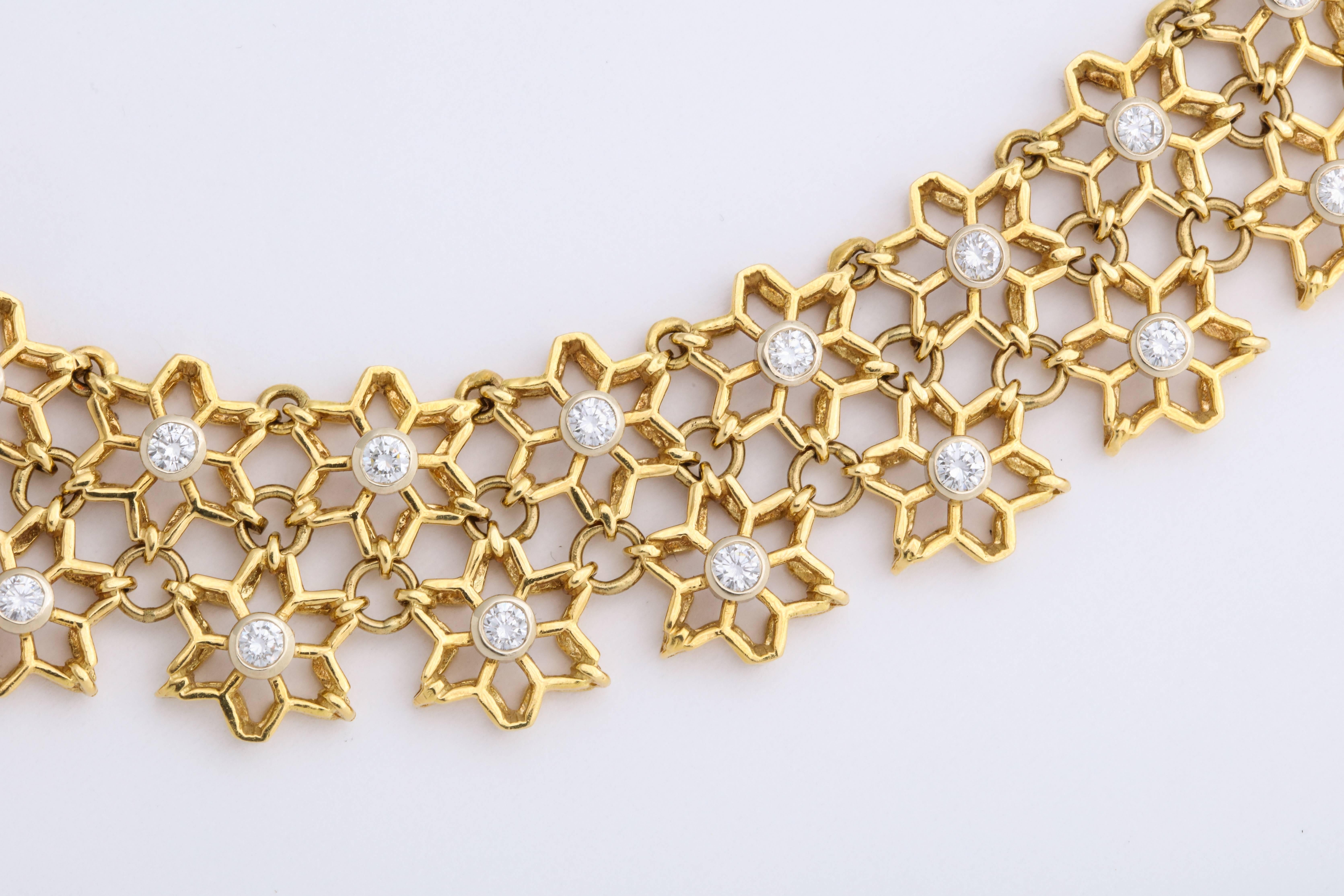 Contemporary Yellow Gold and Diamond Woven Rows of Snowflake Cutouts For Sale