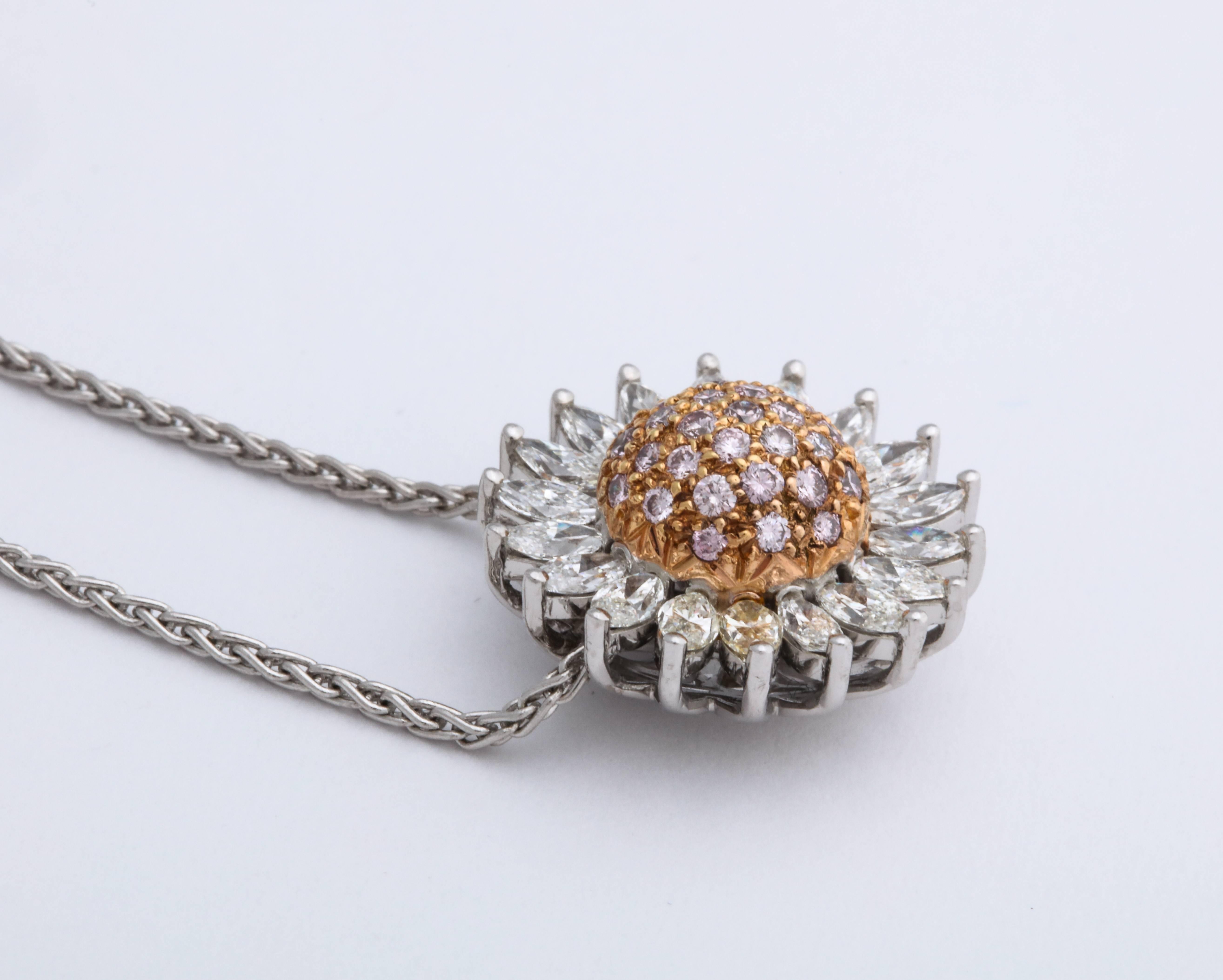 Domed semi-sephirical Rose Gold pave-set with round brilliant-cut natural fancy pink diamonds weighing 0.40 carats, radiating with prong-set colorless marquise diamond trim weighing 1.33 carats. The pendant floats freely on the concealed 18K white