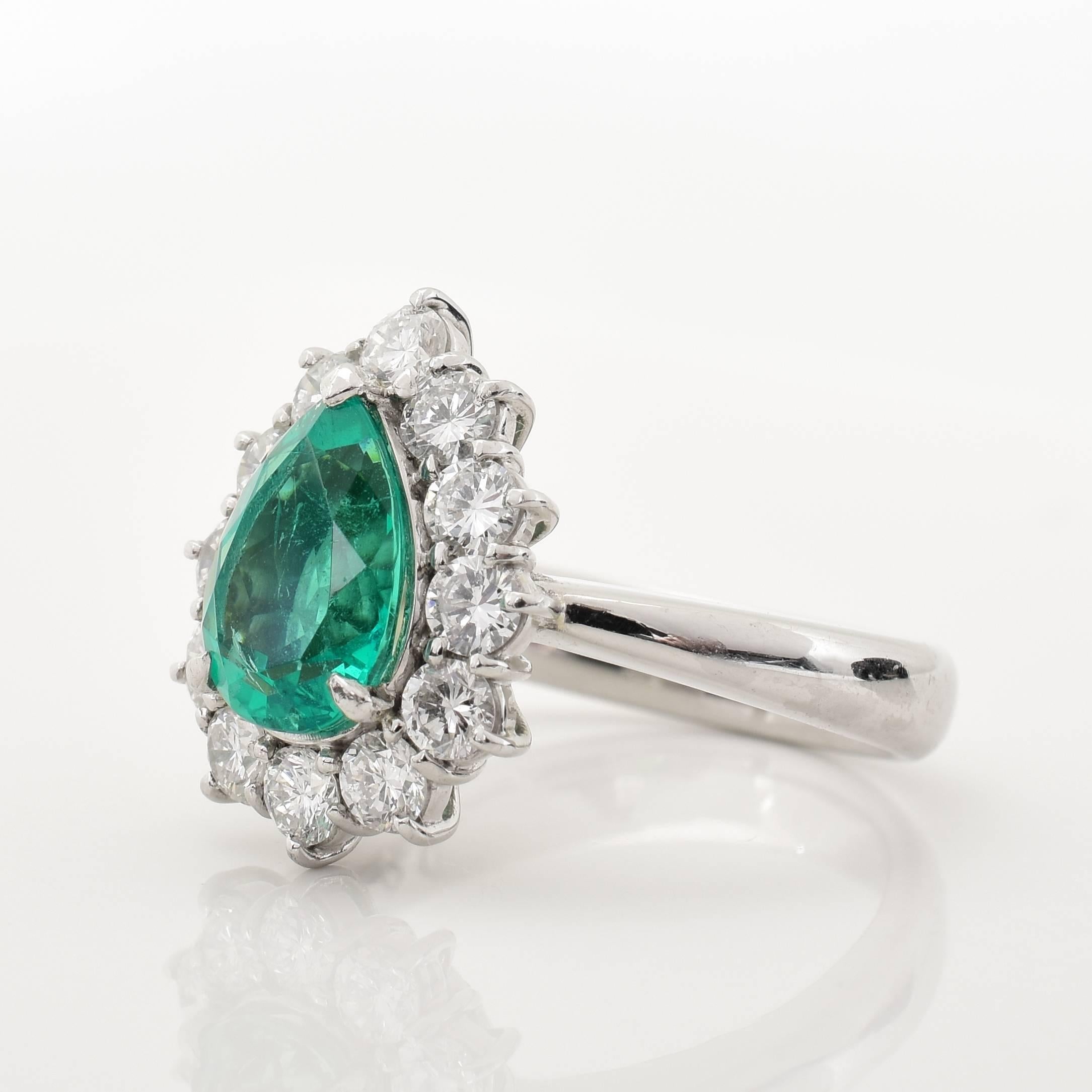 This ring features a 1.62 carat Pear Shape Emerald center stone, surrounded by .95 carats of diamonds, in a platinum mounting.