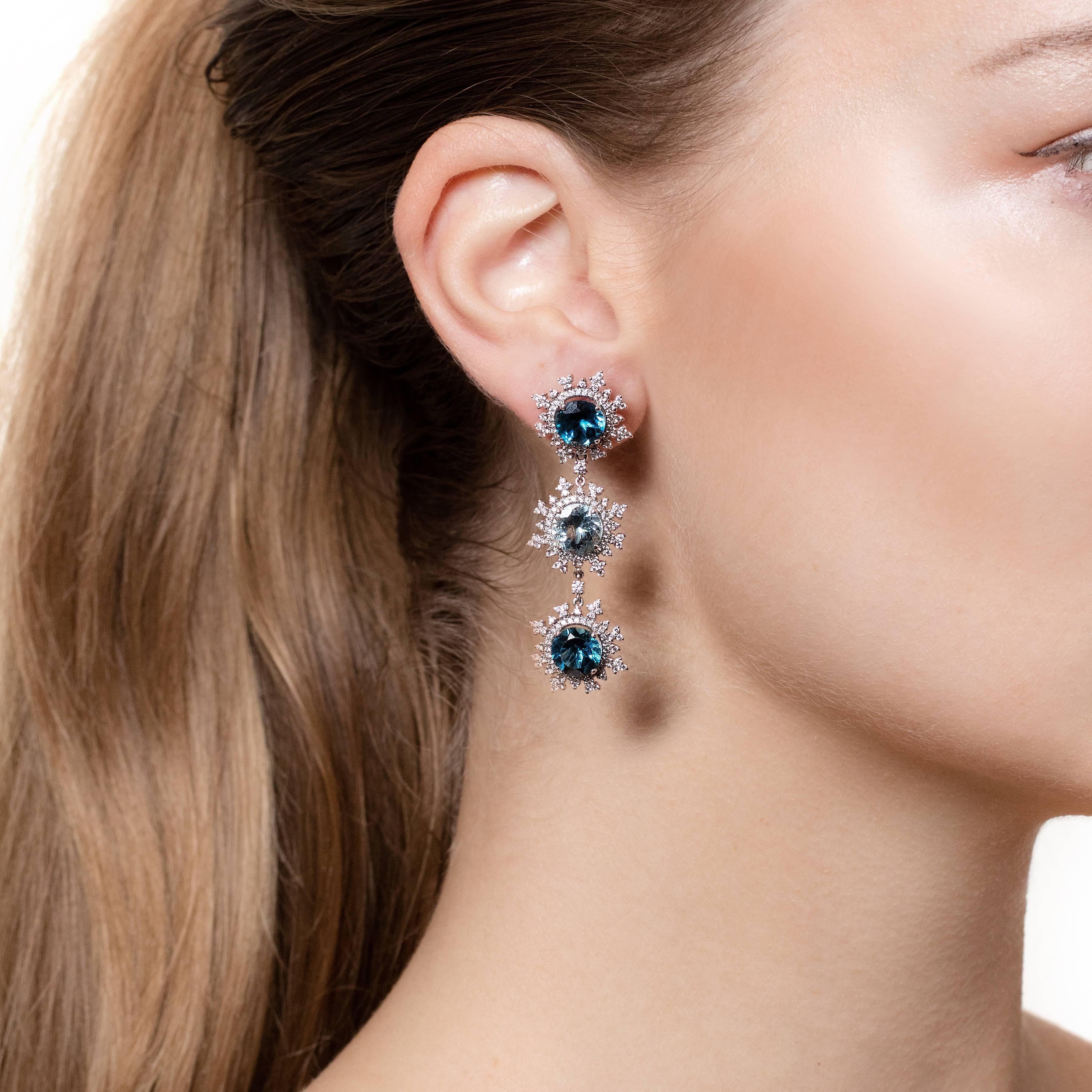 A stunning pair of long detachable flake earrings that are made from 18ct. white gold with aquamarine, deep blue topaz and surrounded by 338 diamonds. They are part of Nadine Aysoy’s Tsarina Collection where nature is an incredible source of