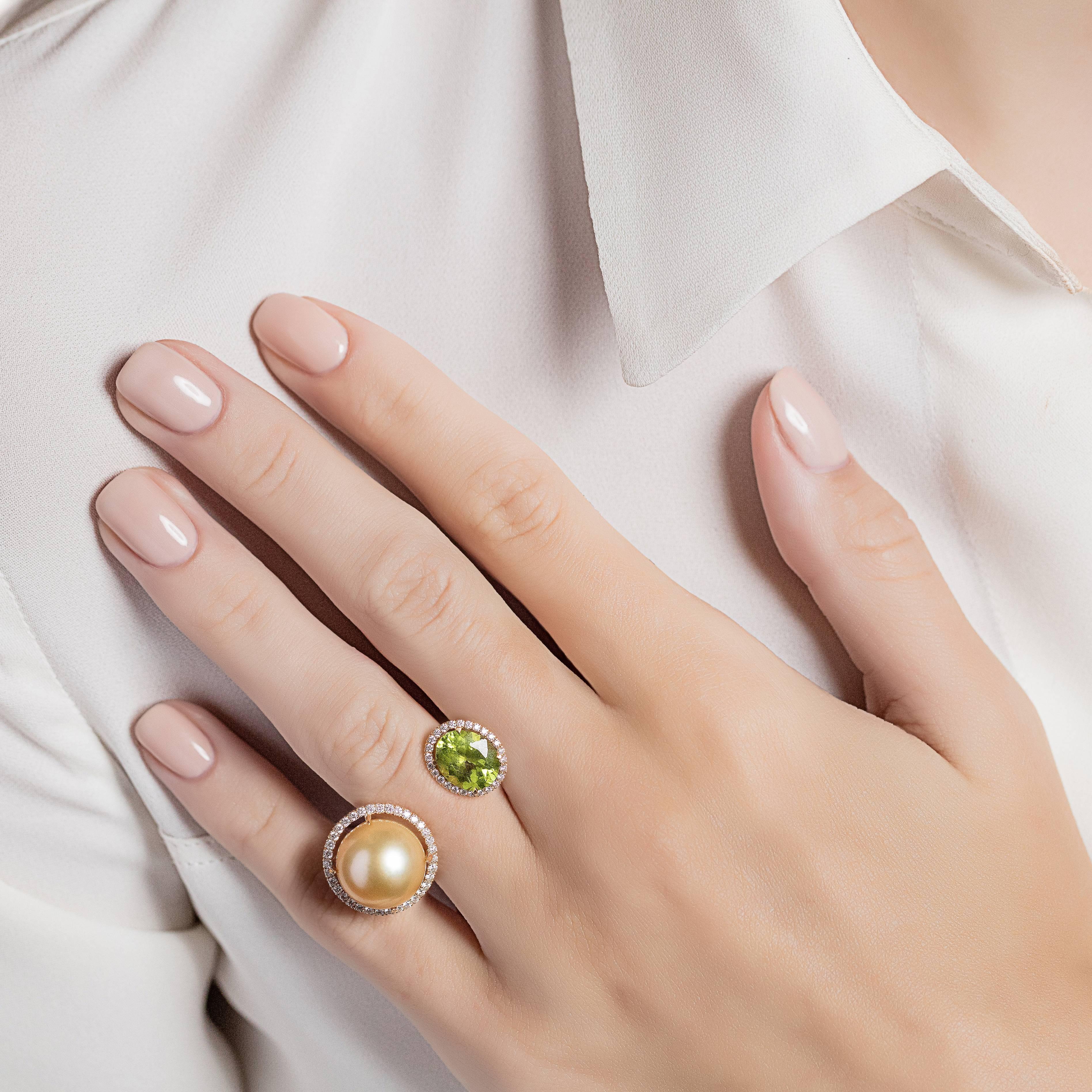 A beautiful and eye-catching between the finger ring made from 18K yellow gold with green peridot and yellow south sea pearl, each surrounded with diamonds. From the Elle et Lui collection, which symbolises the interaction of extremes – men and