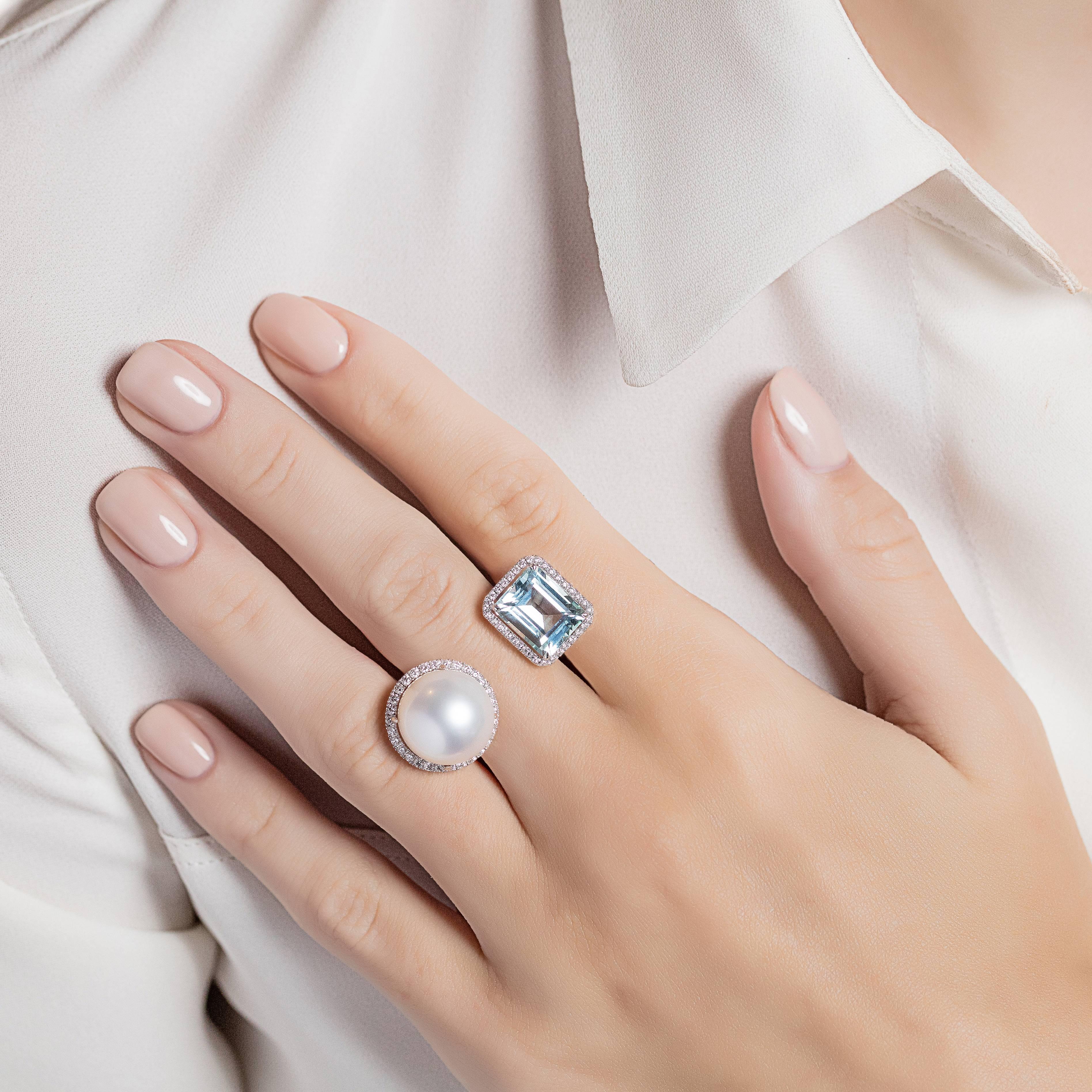 A striking between the finger ring made from white gold with aquamarine and a white south sea pearl, each surrounded with diamonds. The Elle et Lui collection symbolises the interaction of extremes – men and woman – which formed the basis for the