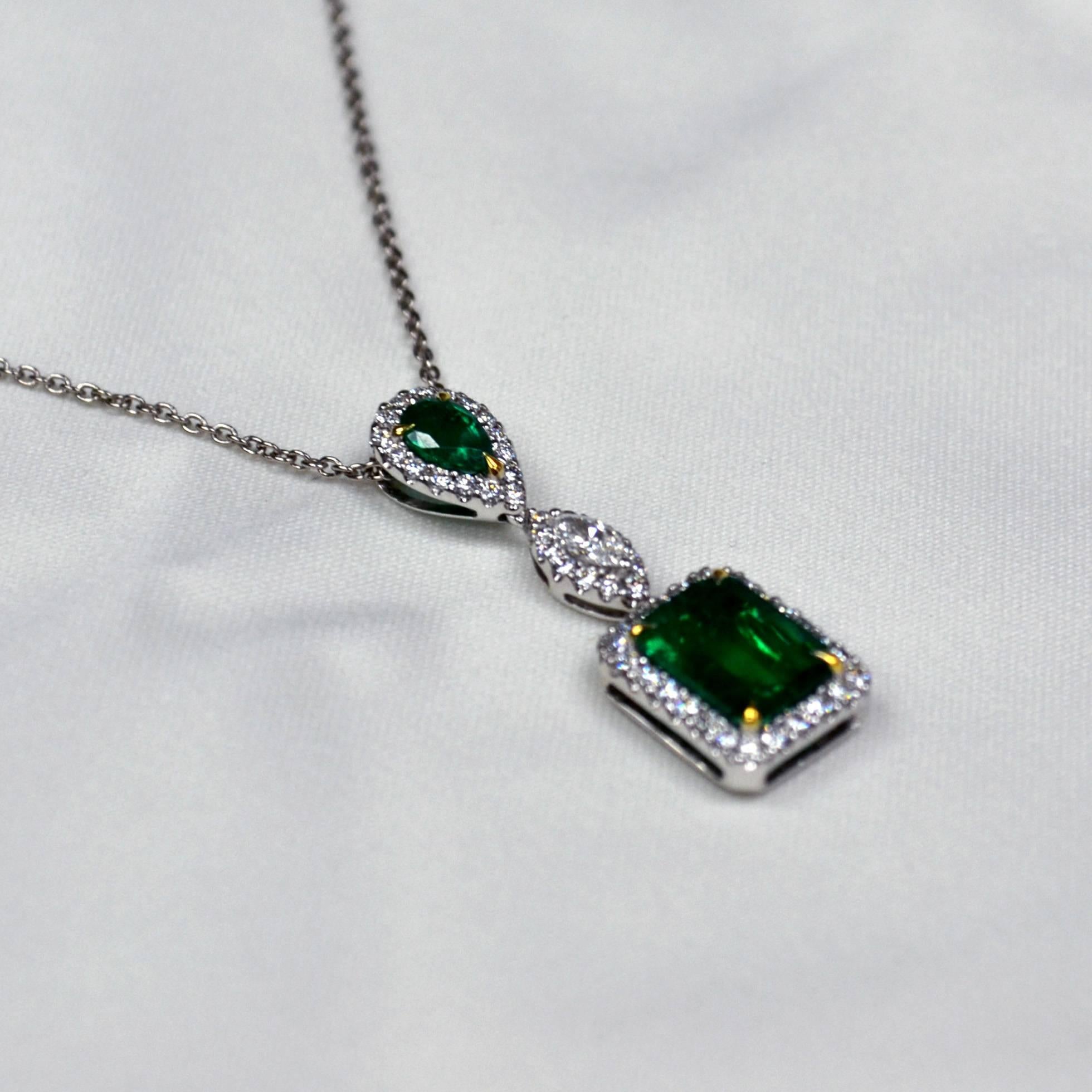 Necklace in 18 karat white gold set with 2 intense green emerald cut Zambian Emeralds (1.95 carats) and 24 round brilliant-cut Diamonds (0.26 carats).

Length of lobster clasp chain: 17 inches.

