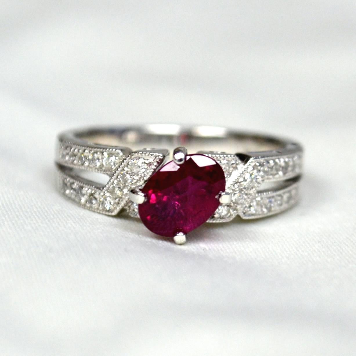 Ring in 18 karat white gold set with an oval 7x5 mm vivid red Mozambique Ruby ( 1.18 carat) and round brilliant-cut Diamonds (0.22 carats).

Ring US Size 6
*Complimentary resizing service*