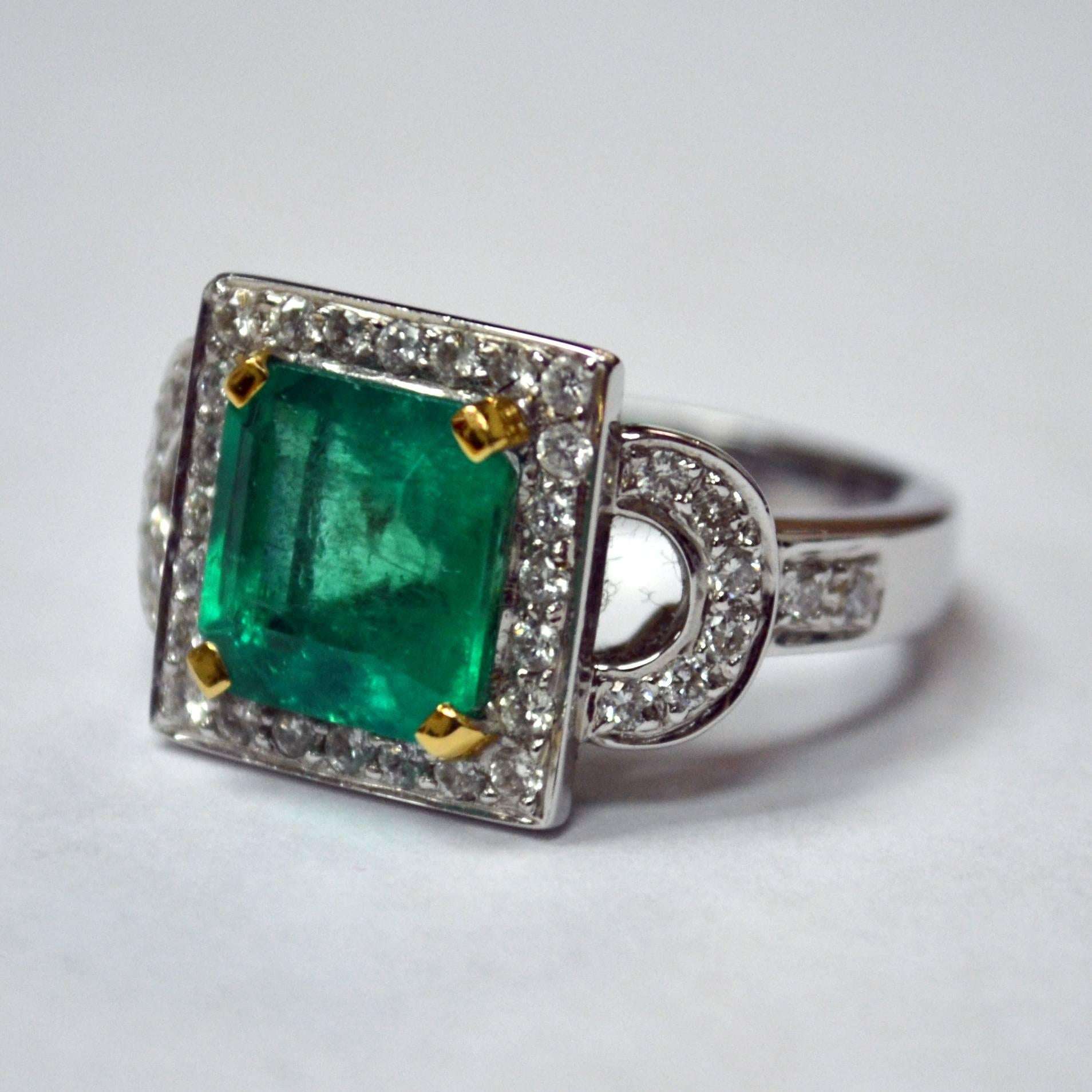 Ring in 18K two-tone gold set with an emerald cut Zambian Emerald (3.82 carat) and 40 round brilliant-cut Diamonds (0.55 carat).

Ring Size US 7
*Complimentary Resizing Service*