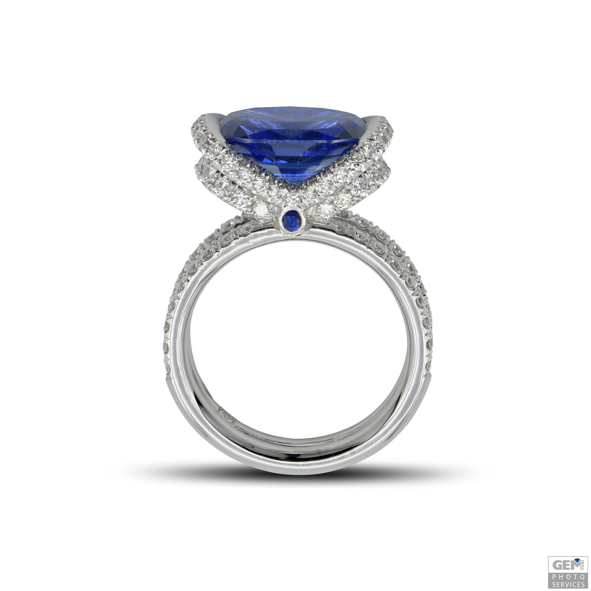 A unique sapphire cocktail ring, designed around a 5,58 carat vivid blue cushion sapphire. The sapphire is full of life and color, and is really a splendid stone. The origin of the sapphire is traced back to Sri Lanka.

The ring has been designed