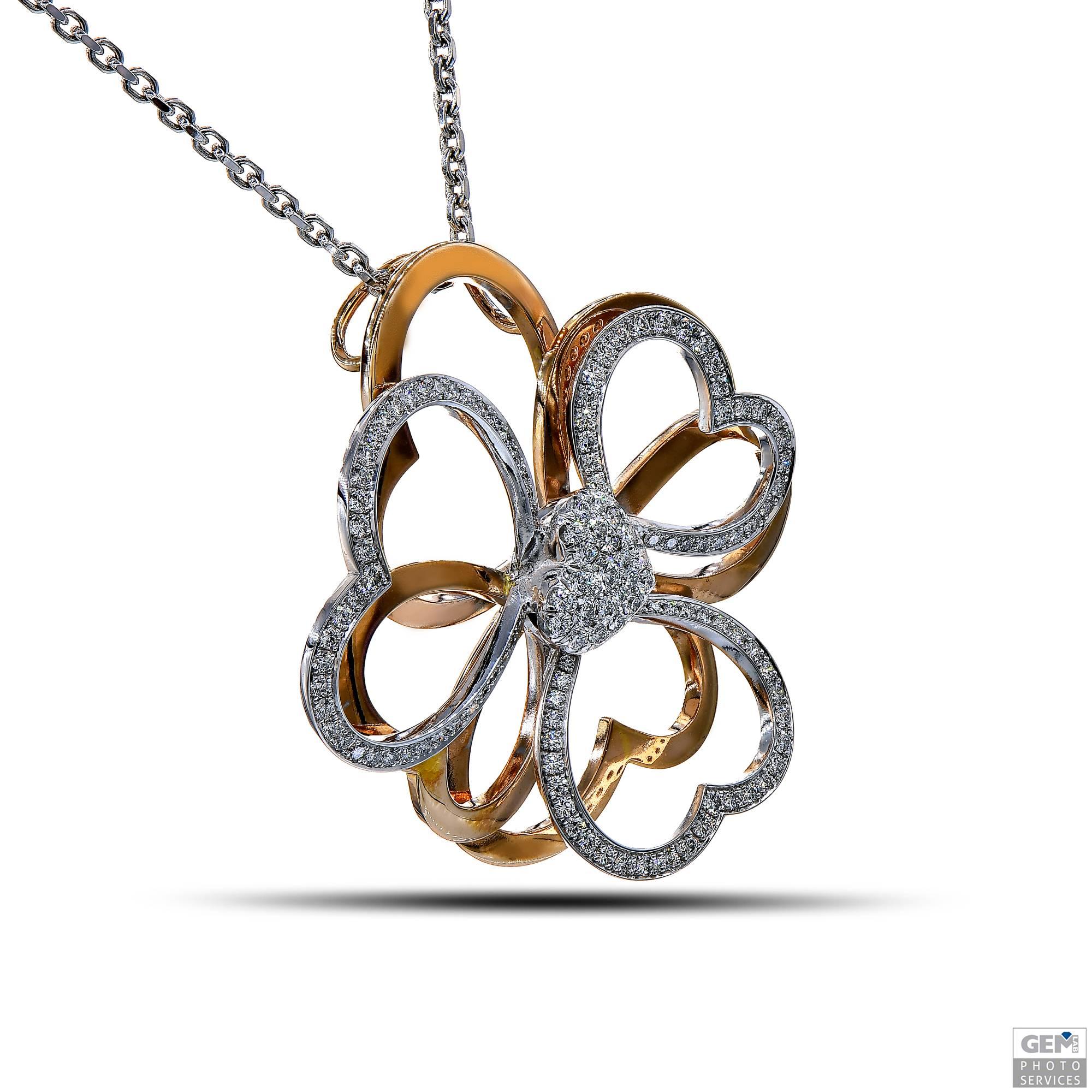 This flower inspired pendant is a special creation by Carigi as a set of hearts. The leaves of the flower are all different heart shapes, connected as a pendant by a center heart shape, entirely set with small round diamonds for a total of 2,01