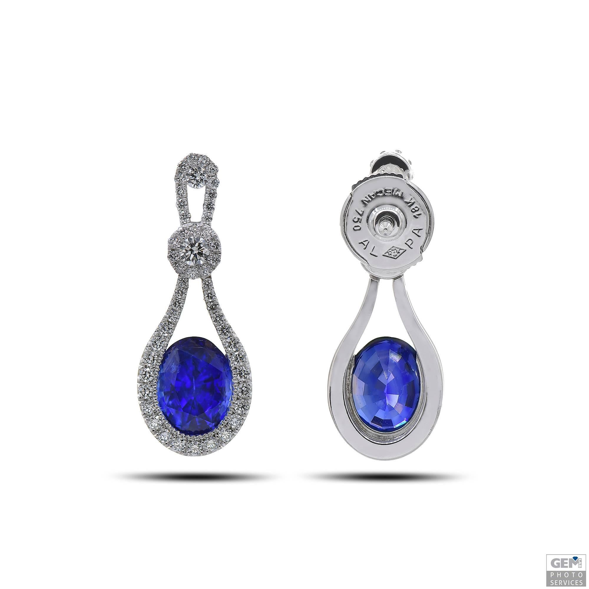 Oval Cut Diamond and Blue Sapphire Dangle Earrings in White Gold For Sale