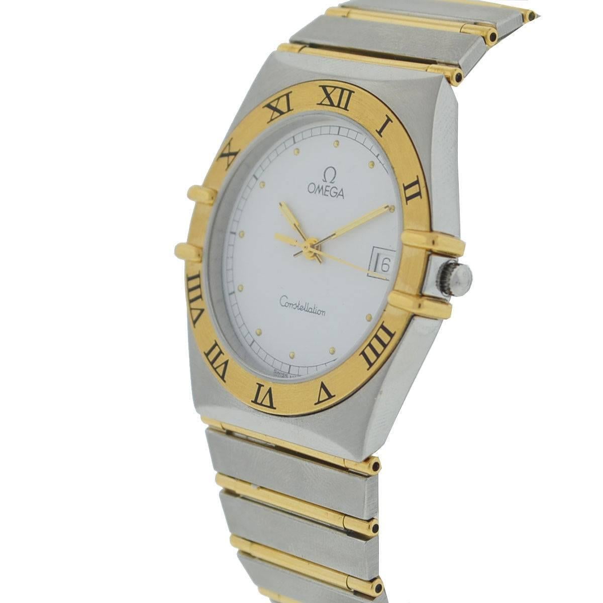 Company - Omega
Style - Dress/Formal
Model - Constellation
Reference Number - n/a
Case Metal - Two Tone
Case Measurement - 34 mm 
Bracelet - Two Tone
Dial - White
Bezel - Gold
Crystal - Plastic
Movement - Automatic
Features - Hours, Minutes, and
