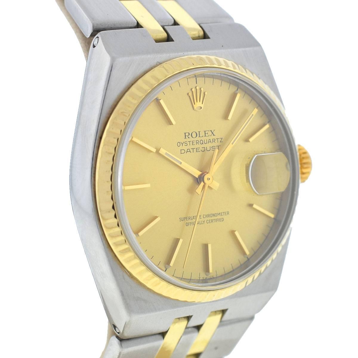 Company - Rolex
Model - Datejust 17013
Case Metal - Stainless Steel
Case Measurement - 36mm
Bracelet - Stainless Steel / 18k Yellow Gold
Dial - Champagne 
Bezel - Yellow Gold Fluted
Crystal - Scratch Resistant Sapphire
Movement - Quartz
Features -