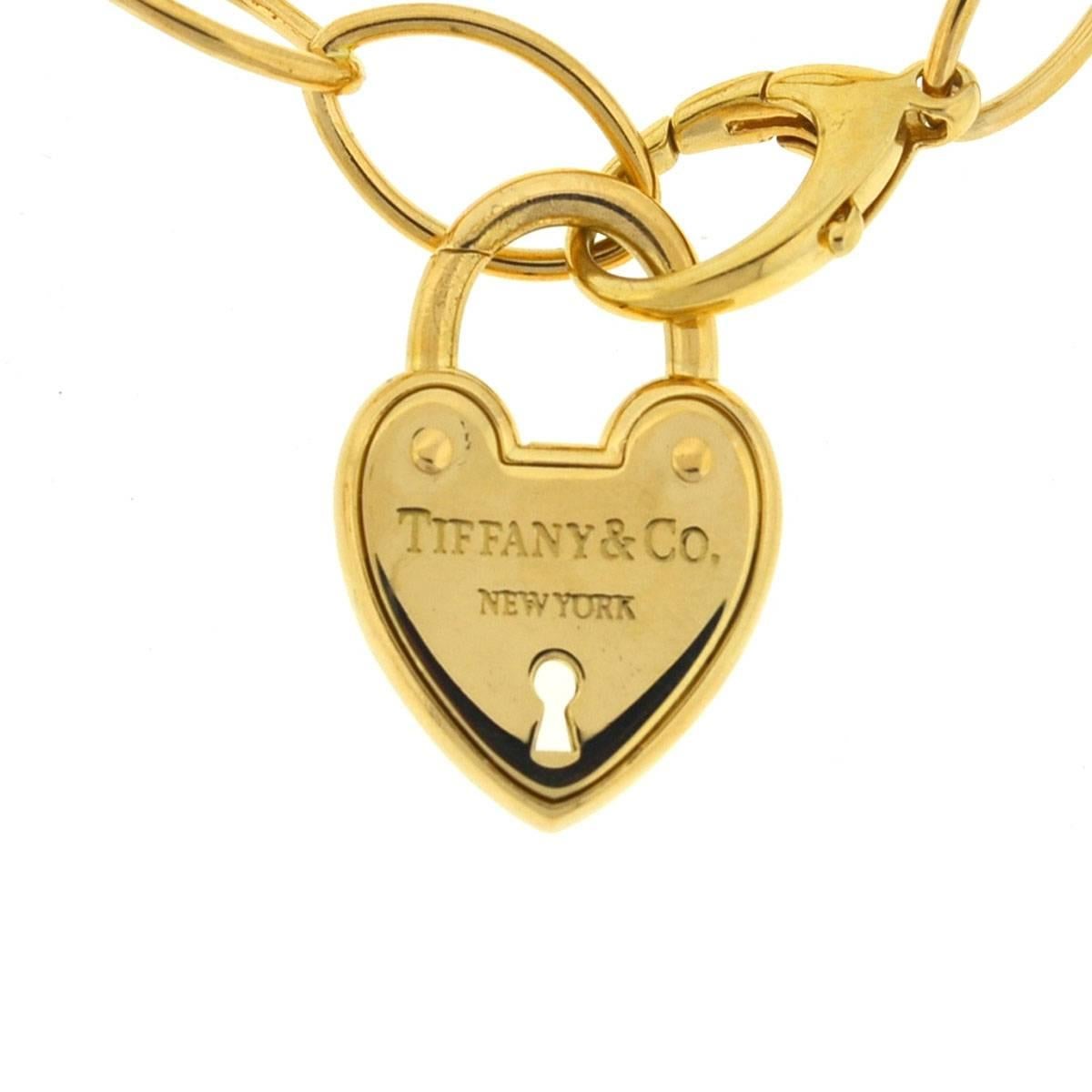 Tiffany & Co. 18 Karat Yellow Gold Link Heart Lock Bracelet In Excellent Condition In Boca Raton, FL