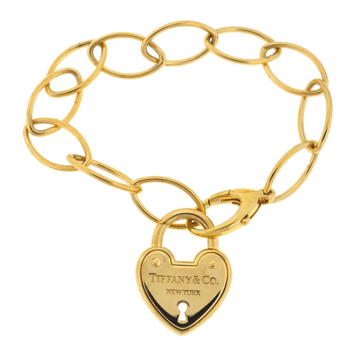 Company - Tiffany & Co
Style - Link Heart Lock 
Metal - 18k Yellow gold
Length- 7