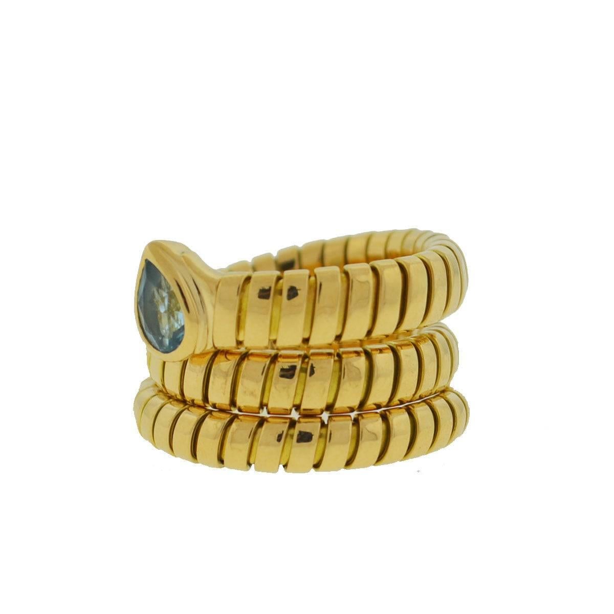 Company - Bvlgari
Style - Tubogas Serpente 
Metal - 18k Yellow Gold
Size - 8, But stretches when on finger, can fit up to a size 10.
Stones - Blue Topaz
Includes - Ring only