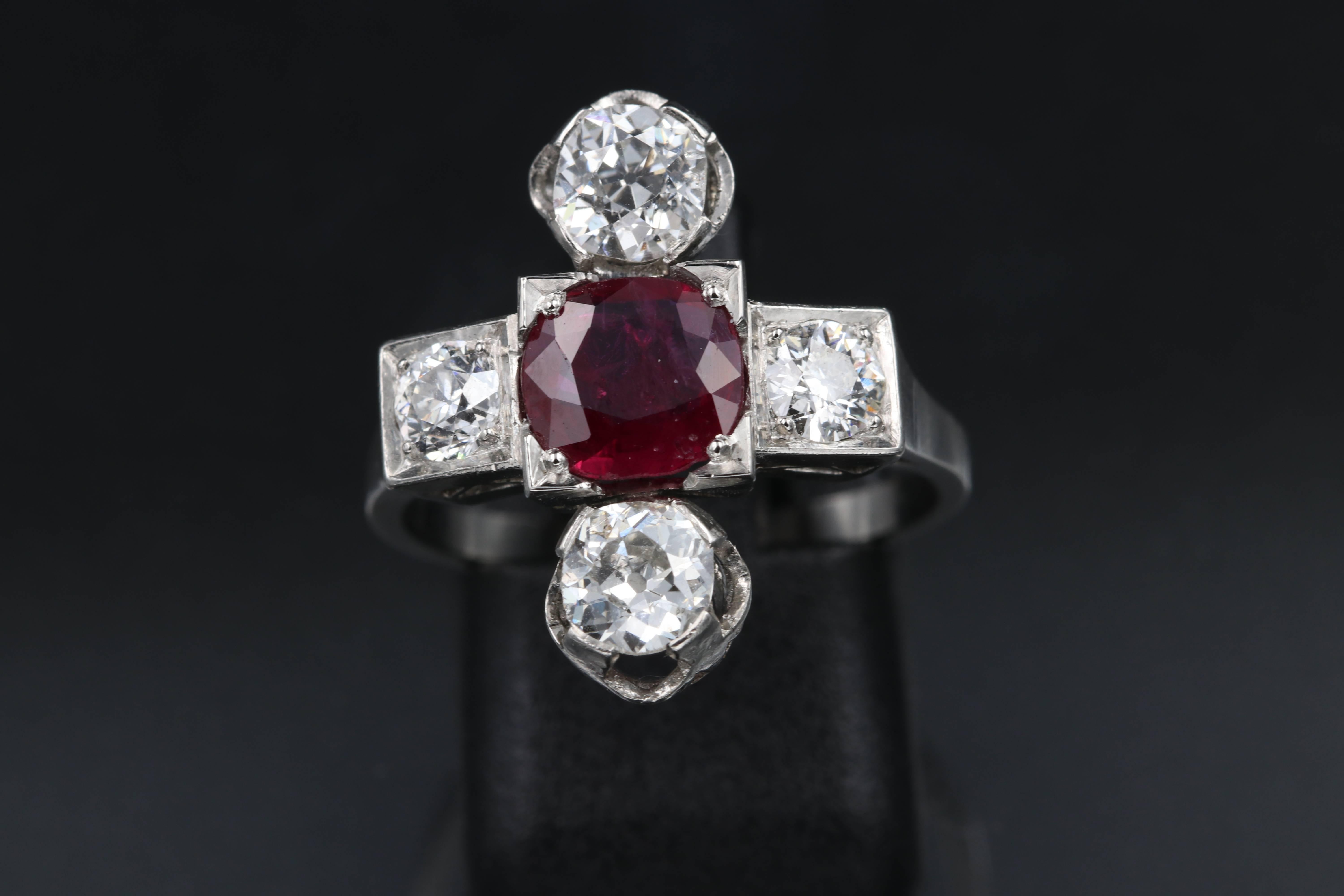 Beautiful art deco ring, with a natural ruby of approximately 1.5 carats. 
The Diamonds weights approximately 1.8 carats for the total.
the ring has original French marks.
Made in France circa 1930.
the size is 55 europe or 7.25 US. Sizeable
The
