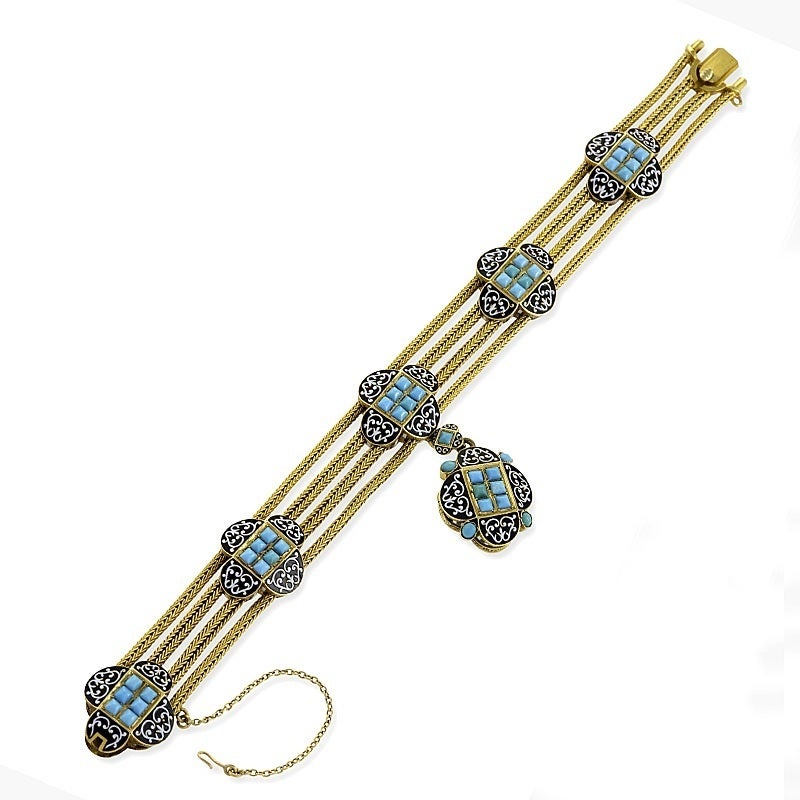 A French Antique 18-karat gold and enamel bracelet with turquoise. The bracelet is composed of 4 strands of woven gold rope with clover-shaped enamel and turquoise set slides. The enamel work is designed as Moorish arabesques set with cabochon