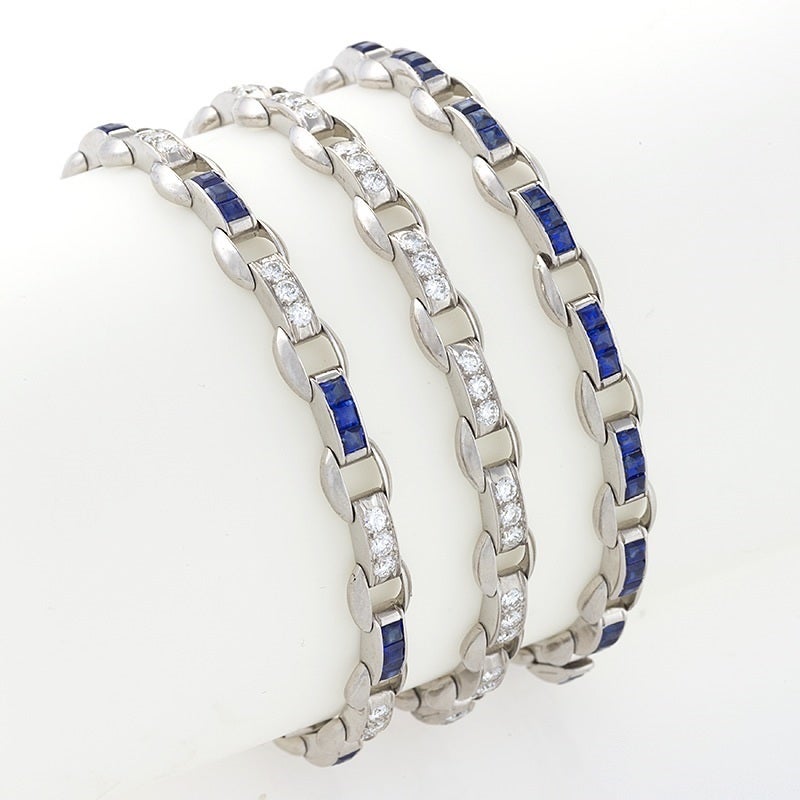 A set of three American Estate platinum bracelets, one with all diamonds, all sapphires, and diamonds and sapphires attributed to Oscar Heyman. The diamond bracelet has 48 round-cut diamonds with an approximate total weight of 2.50 carats; the