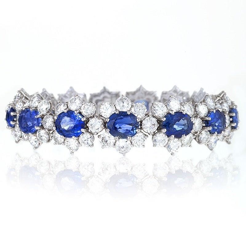 A French platinum bracelet diamond and sapphires by Van Cleef & Arpels. The bracelet has 15 oval sapphires with an approximate total weight (atw) of 16,00 carats and round diamonds with an atw of 20.00 carats. French import marks.  

Circa 1978.