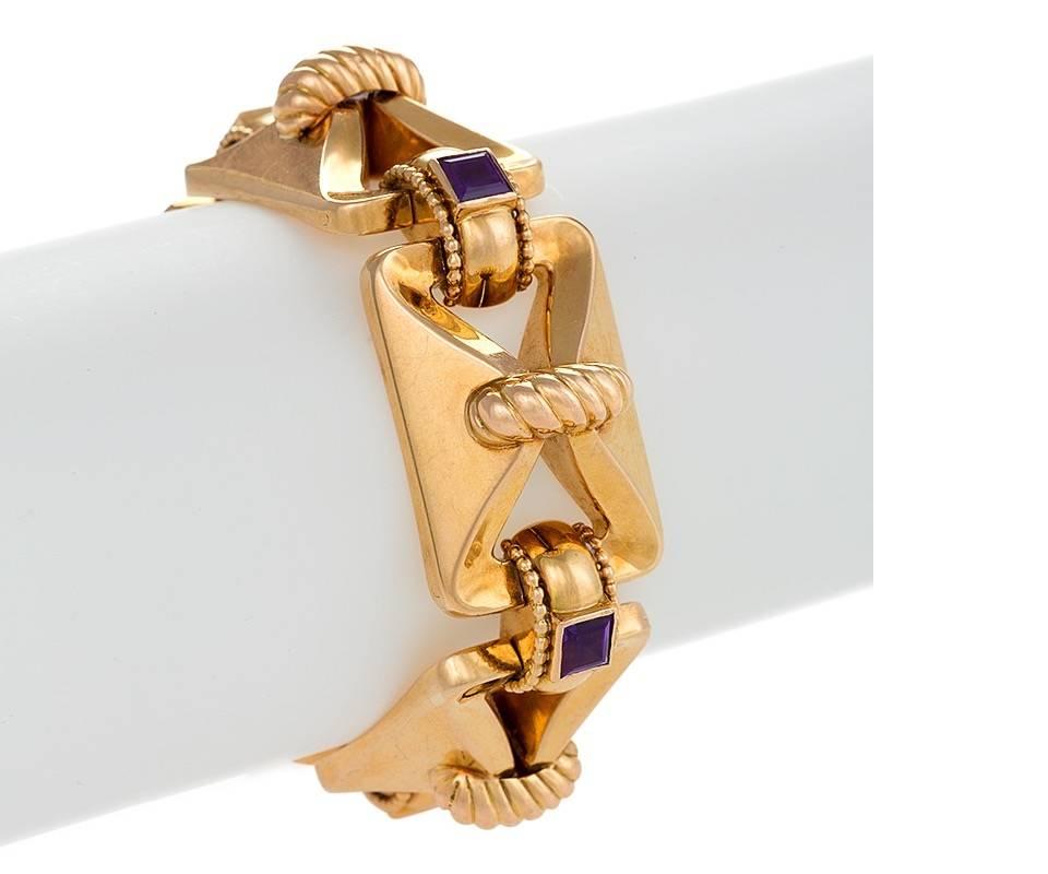 A French Mid-20th Century 18 karat gold bracelet with amethysts. The dimensional link bracelet has 5 square-cut amethysts with an approximate total weight of 2.50 carats. The bracelet is composed of 5 rectangular flexible links connected with 5