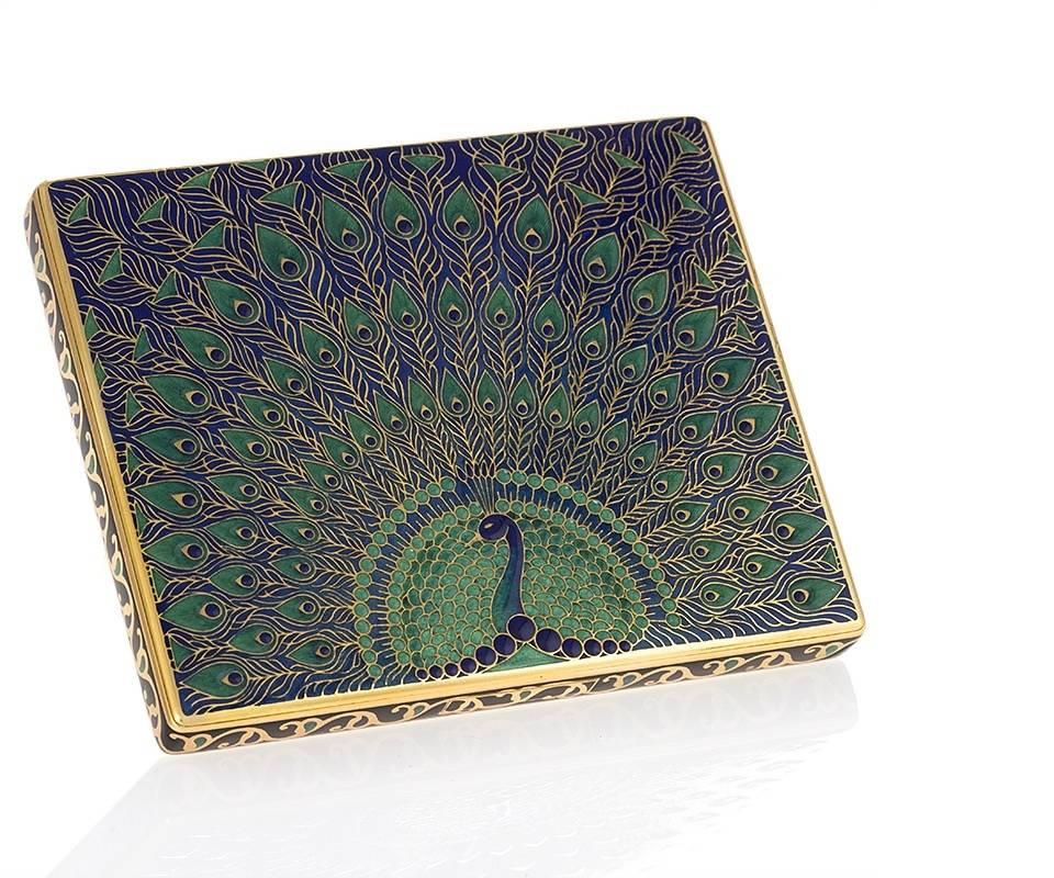 A French 18 karat gold, raised and multi colored enamel “Peacock’ cigarette case with concealed integrated latch button and hinge by Alfred Langlois.  Circa 1930.  

Alfred Langlois was among Van Cleef & Arpels most talented boîtiers, or box makers.