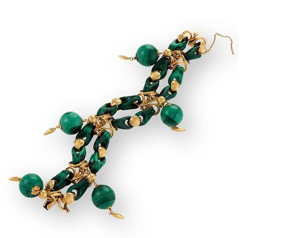 A French Late-19th Century 18 karat gold bracelet with malachite. The 'clamp clip' link double bracelet has 5 malachite hanging balls with engraved links separated by 5 gold dimensional arabesque plaques.  The malachite links are finely hand carved