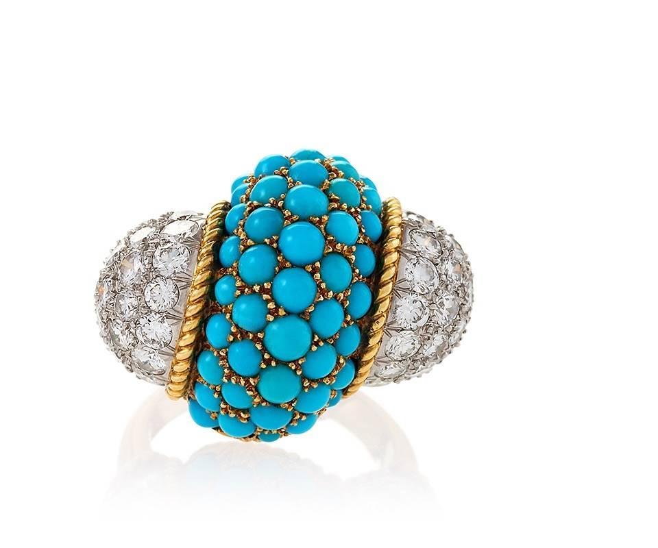 A Mid-20th Century 18 karat gold cocktail/dinner ring with diamonds and turquoise by Cartier. The ring has 52 round diamonds with an approximate total weight of 3.70 carats, and 46 cabochon turquoise stones set in twisted and gadrooned gold. Circa