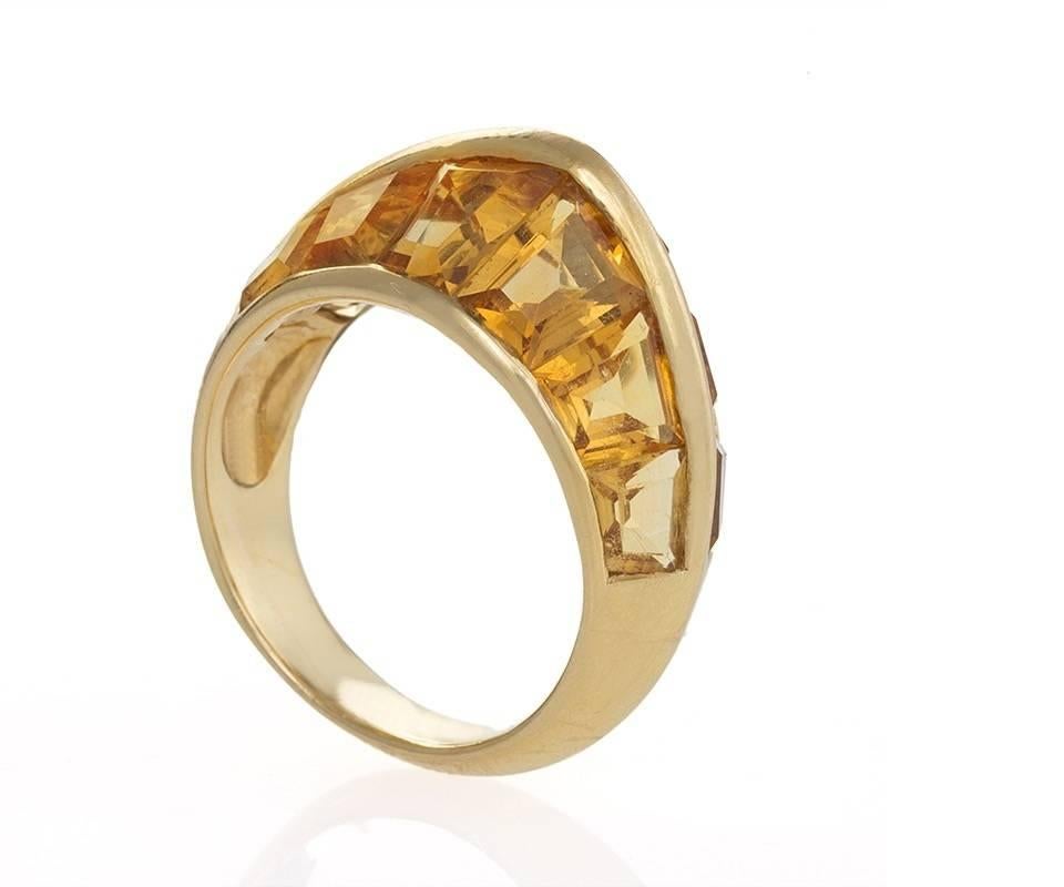 A French Art Deco 18 karat gold ring with citrine stones by René Boivin/Suzanne Belperron. The ring has 12 calibre-cut citrine stones with an approximate total weight of 7.00 carats. Designed by Suzanne Belperron made by René Boivin. Letter of