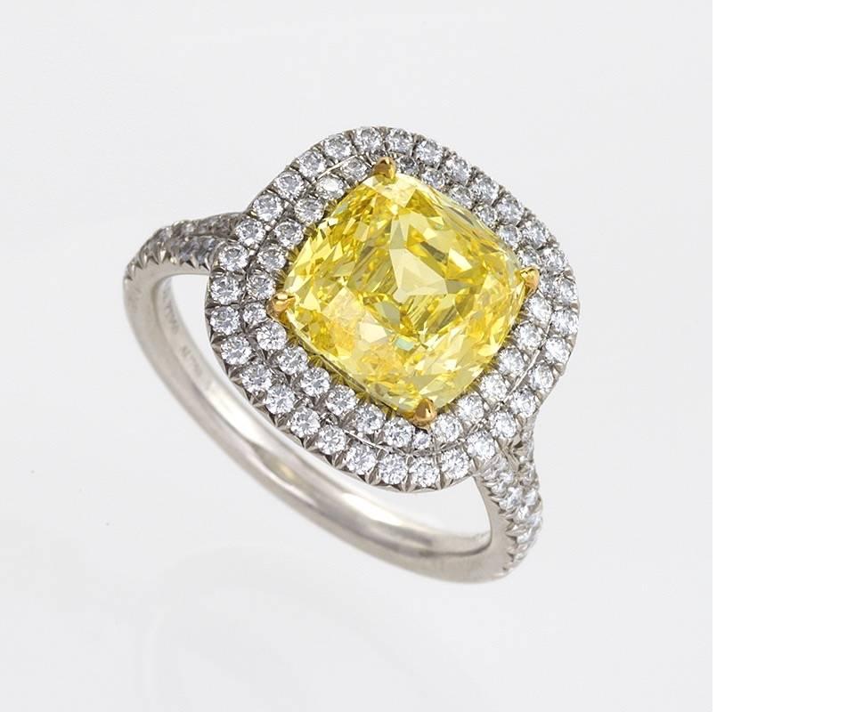 An Estate platinum ring with yellow and white diamonds by Tiffany & Co. The ring is composed of a  