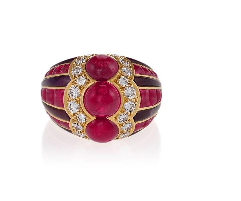 A French made Late-20th Century polished 18 karat gold ring with ruby, diamond and amethyst by Bulgari. The ring has 3 cabochon rubies with an approximate total weight of 6.46 carats, 30 square buff-cut rubies with an approximate total weight of