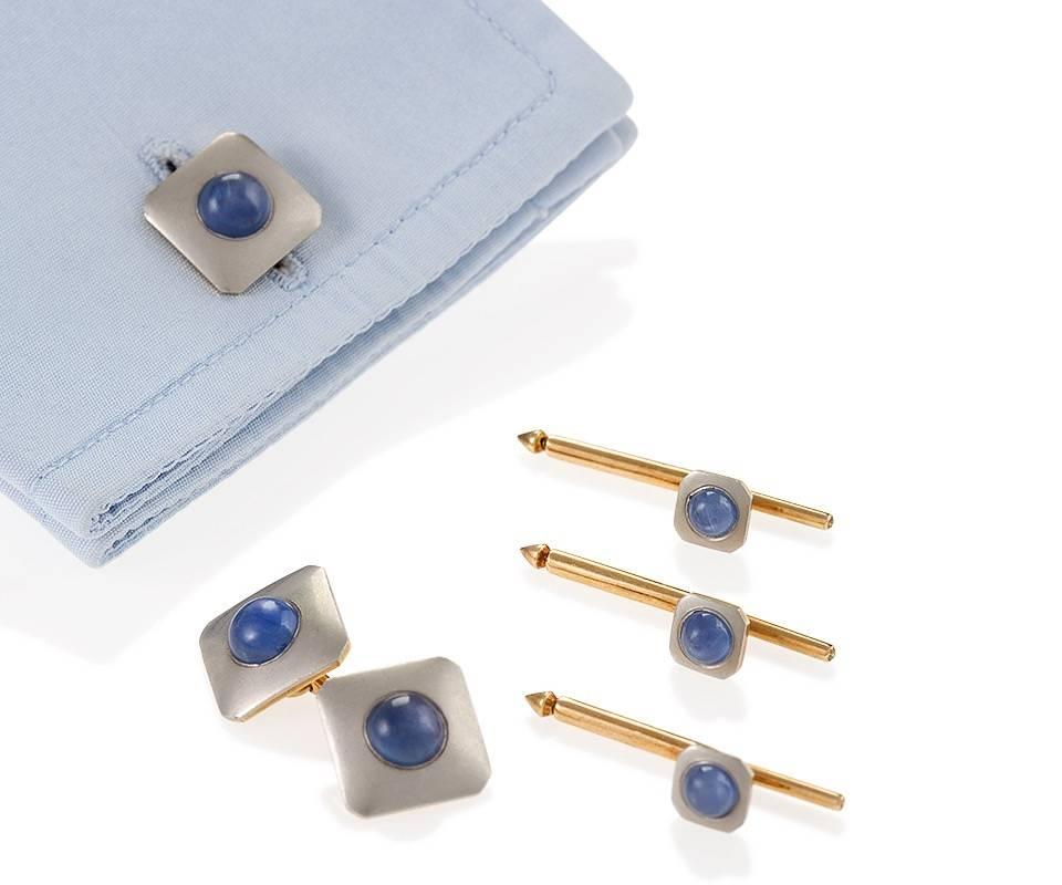 An American 14 karat gold and platinum dress set with 7 blue cabochon sapphires with the approximate total weight of 3.60 carats by L.E. Garrigus & Co. The cuff links are double sided with 3 dress studs.   Circa 1930's.

This dress set was