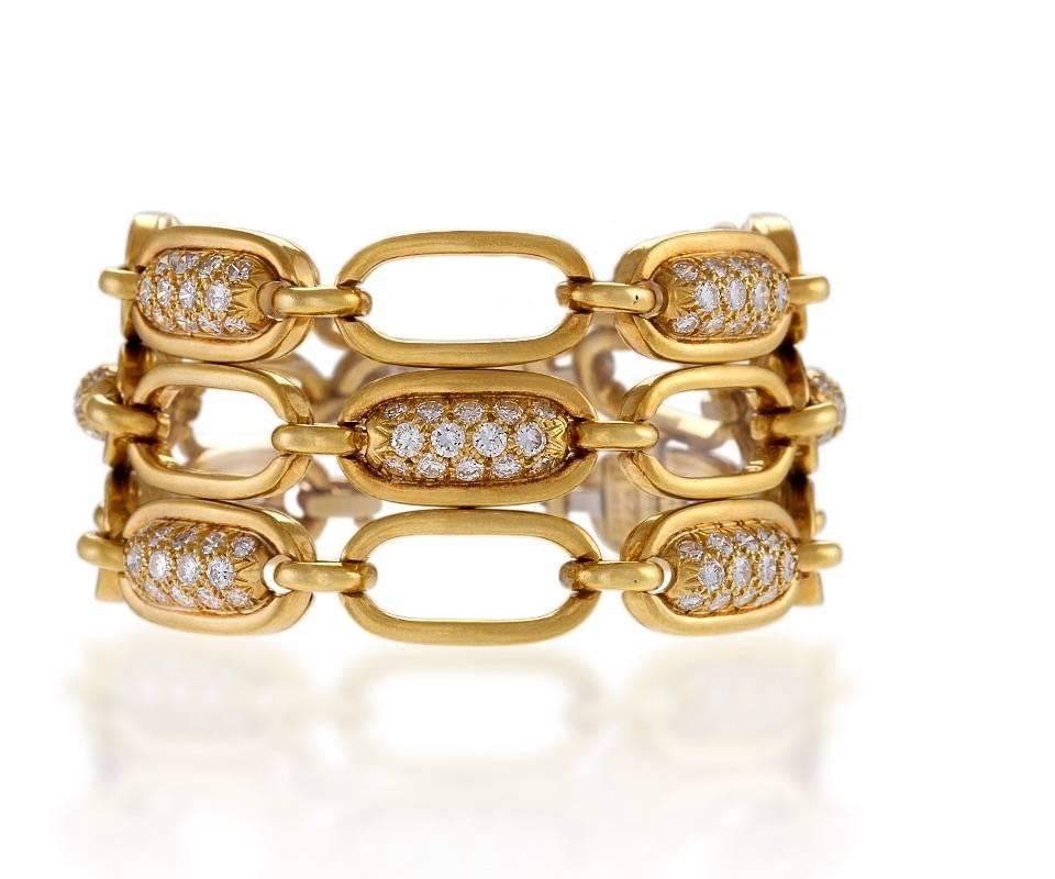 A set of three 18 karat gold bracelets with diamonds by Van Cleef & Arpels. The 3 link bracelets have a total of 168 pavé-set round cut diamonds with an approximate total weight of 7.30 carats. The 4 diamond set links alternate with 4 polished