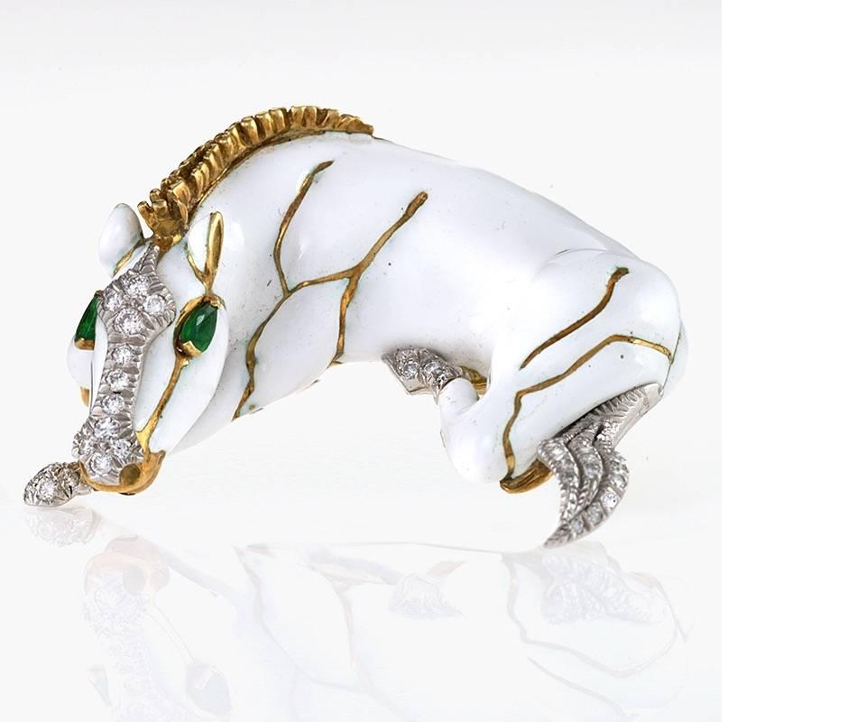 An American Late-20th Century 18 karat gold, platinum and enamel brooch with diamonds and emeralds by David Webb. The brooch has 45 round-cut diamonds with an approximate total weight of .50 carats, and 2 pear-shape emerald eyes with an approximate