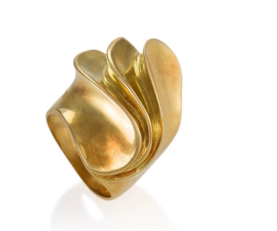 A French 18 karat gold ring. The ring is designed in a Modernist, dimensional swirl motif.  Circa 1970's.

Signed, French control mark. 

Ring size 8; this ring can be sized. 
(MG #18223)