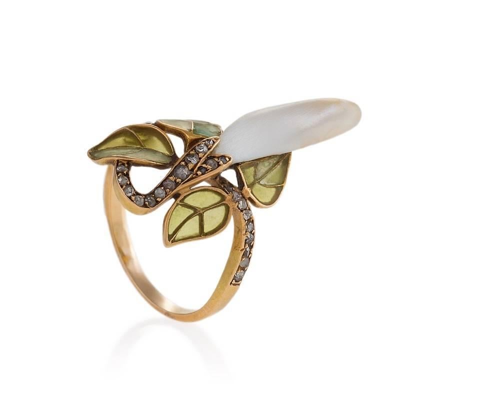 A French Art Nouveau 18 karat gold and plique-à-jour enamel ring with diamonds and pearl by Georges Le Turcq. The ring has 31 rose cut diamonds with an approximate total weight of .31 carat, and a freshwater baroque pearl. The ring exhibits the