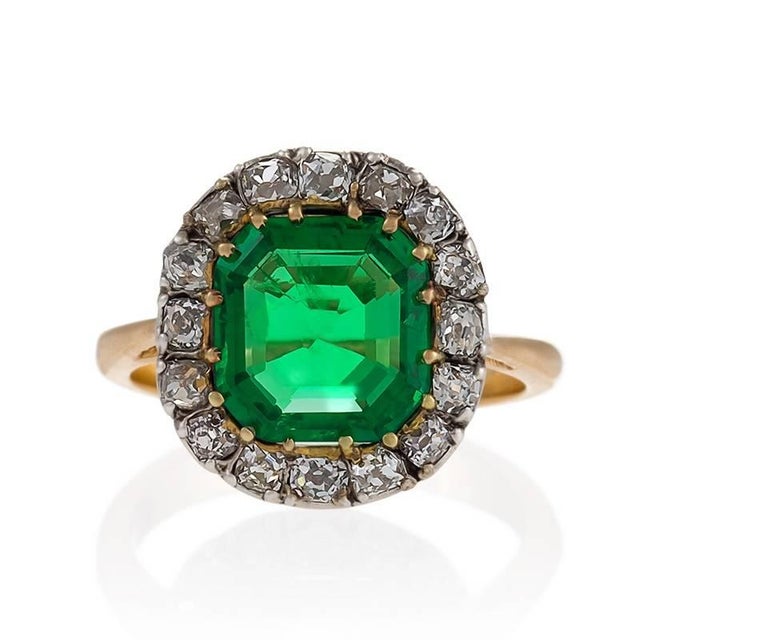 Edwardian Emerald Diamond Gold and Platinum Cluster Ring at 1stDibs